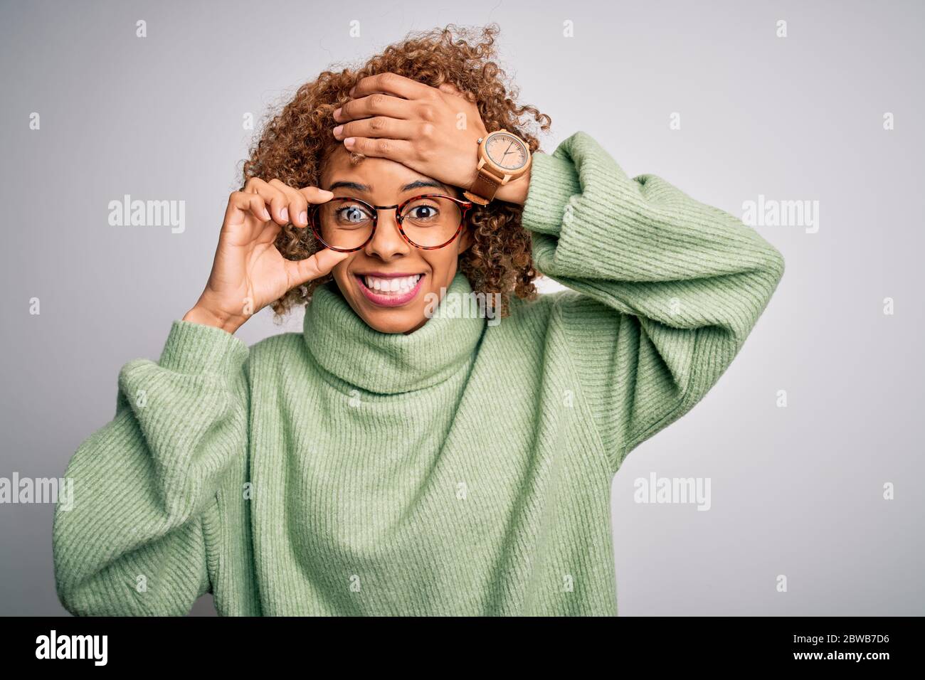 African american optical woman with curly hair wearing glasses over ...