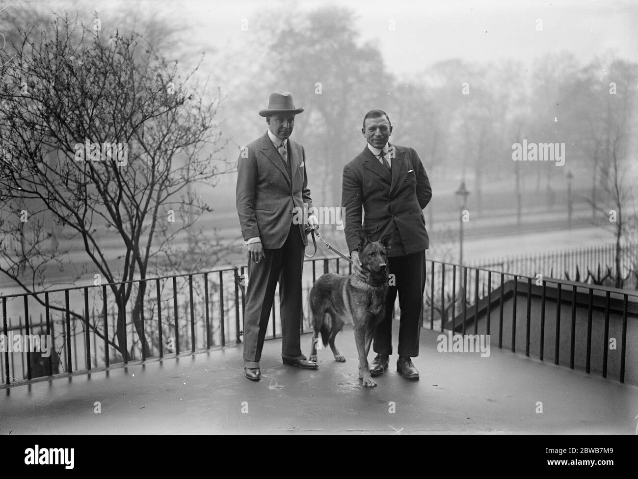 Captain Worsley , Comander of the Algarsson Polar expedition presented with a wolf hound as mascot 28 April 1925 Stock Photo