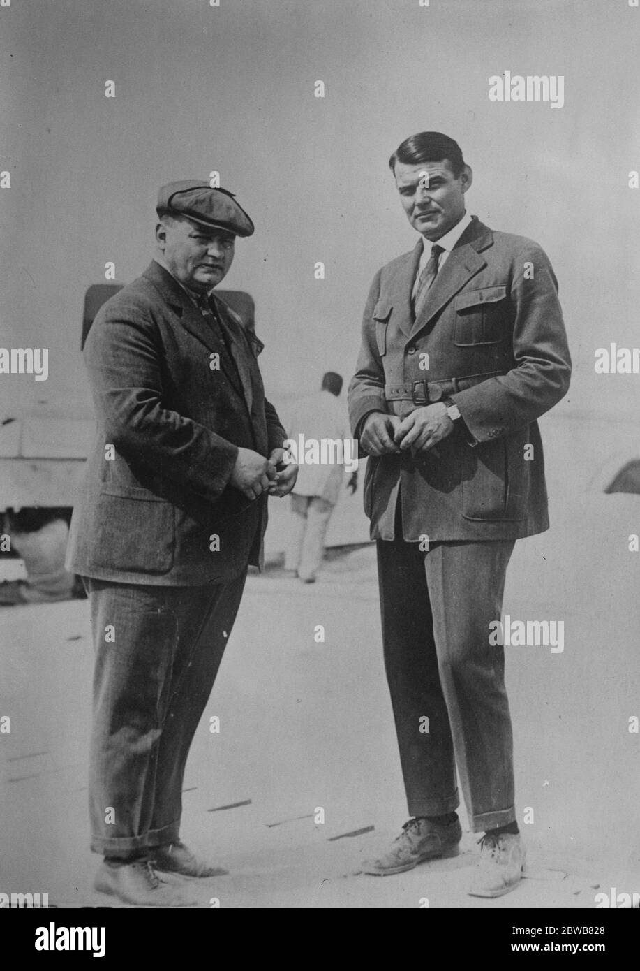 The Italian round - the - world flight . Signor Hemmer ( left ) and Mr R Larsen , who are accompanying Signor Antonio Locatelli the Italian aviator , on his round - the - world flight in a Dornier Wal seaplane . The party left Pisa on July 24 and are due in London on Saturday . 24 July 1924 Stock Photo