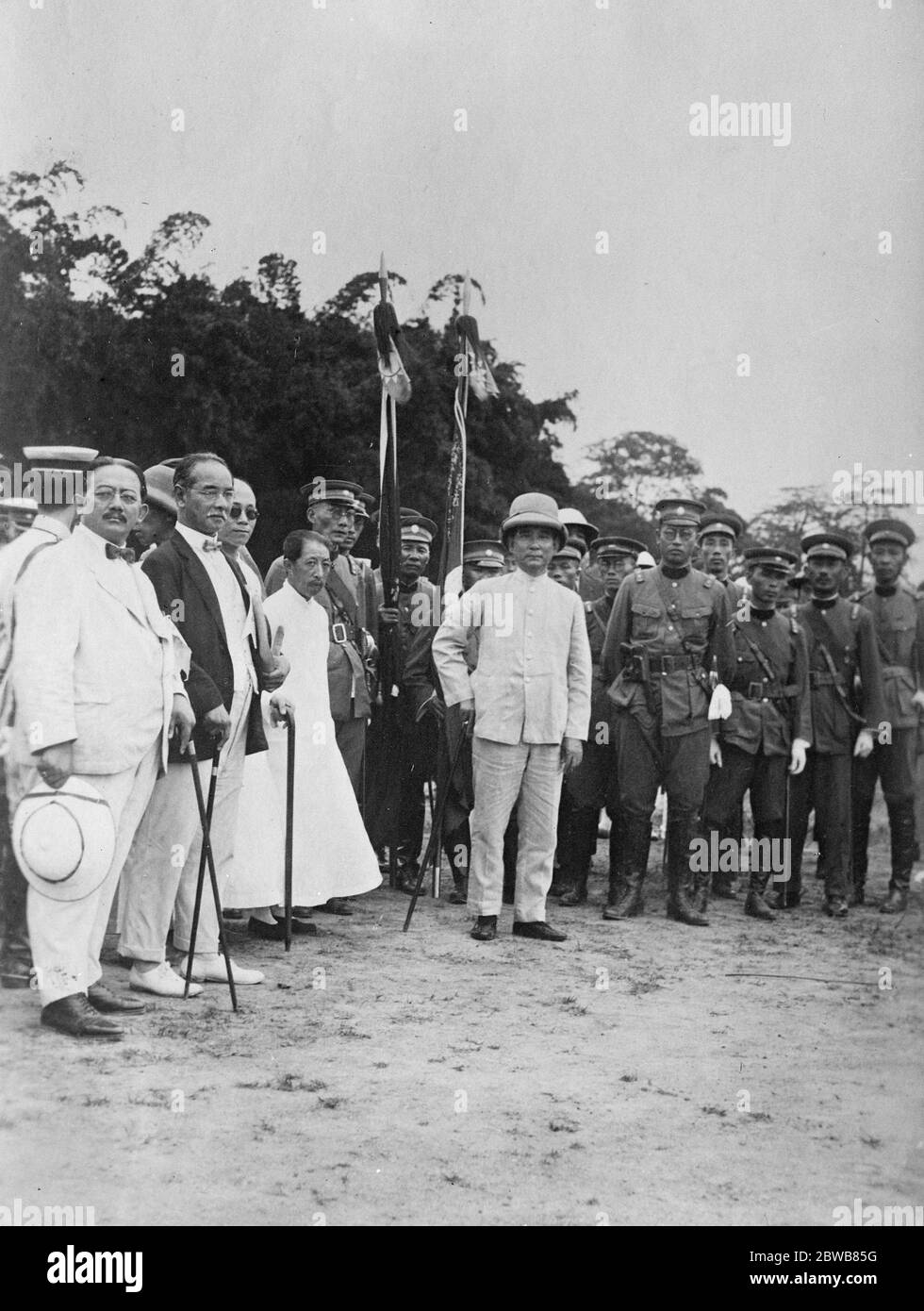 Sun Yat - sen still , ' very much alive ' Dr Sun Yat - Sen , the Chinese ' reform ' leader , who was reported dead , is very much alive . Here he is seen presenting colours to his troops in Canton 12 August 1924 Stock Photo
