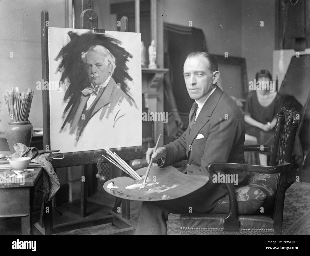 Mr Lloyd George ' s 60th birthday . The latest portrait of Mr Lloyd George which the young painter , Mr A Barnes has undertaken . Picture shows Mr Barnes in his studio . 16 January 1923 Stock Photo