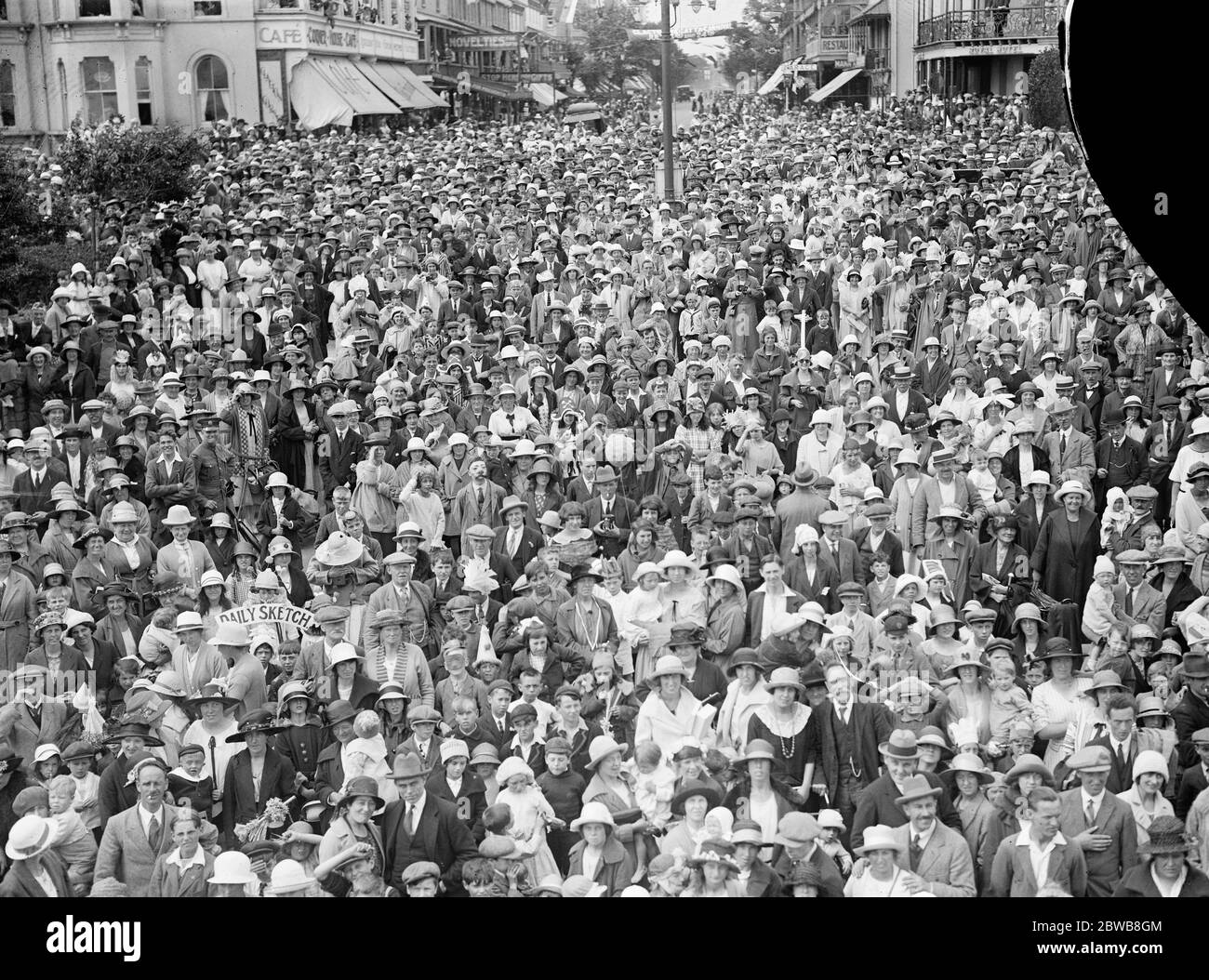 Crowning of carnival King and Queen . The carnival King and Queen were crowned at Clacton - on - Sea in connection with the regatta celebrations . Carnival crowds at Clacton . 24 July 1924 Stock Photo