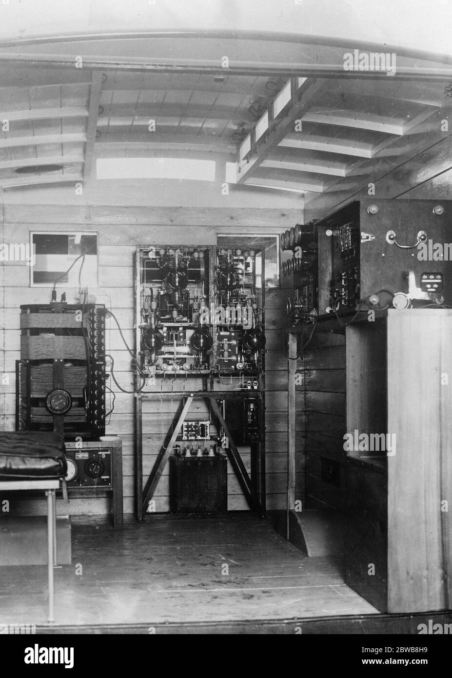 A Marconi Wireless Telegraph and Telephone set installed in a motor car . The transmitting apparatus is shown at the end of the car , and the receiver which is self contained is shown in its case on the extreme right of the picture . Marconi 's Wireless Telegraph Co Ltd . 1 January 1925 Stock Photo