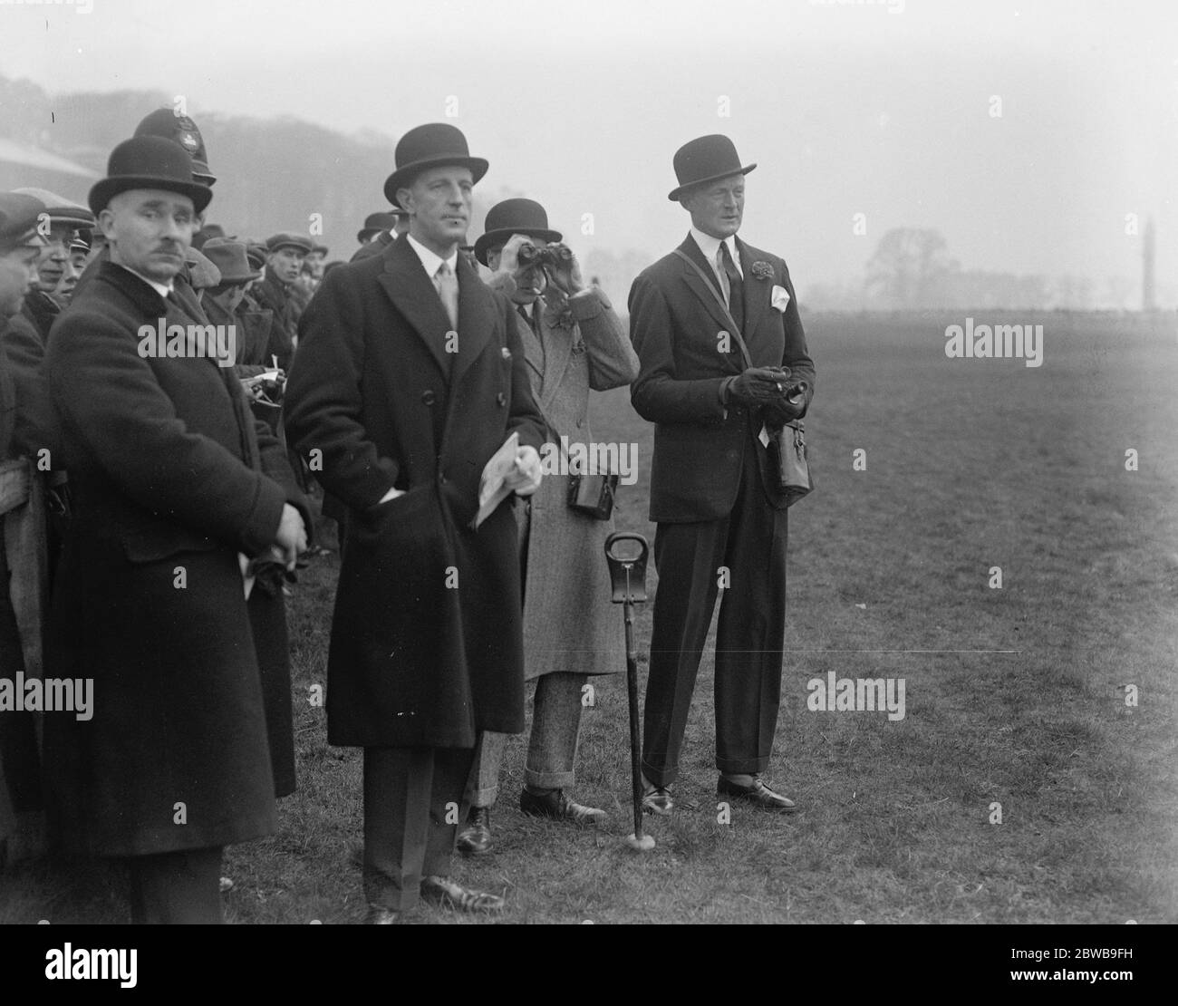 The Prince attends the Sandown Grand Military meeting in Surrey . The Prince watching the race for the Gold Cup . On the right is Lord Westmorland and on the left Major Metcalfe . 16 March 1923 Stock Photo