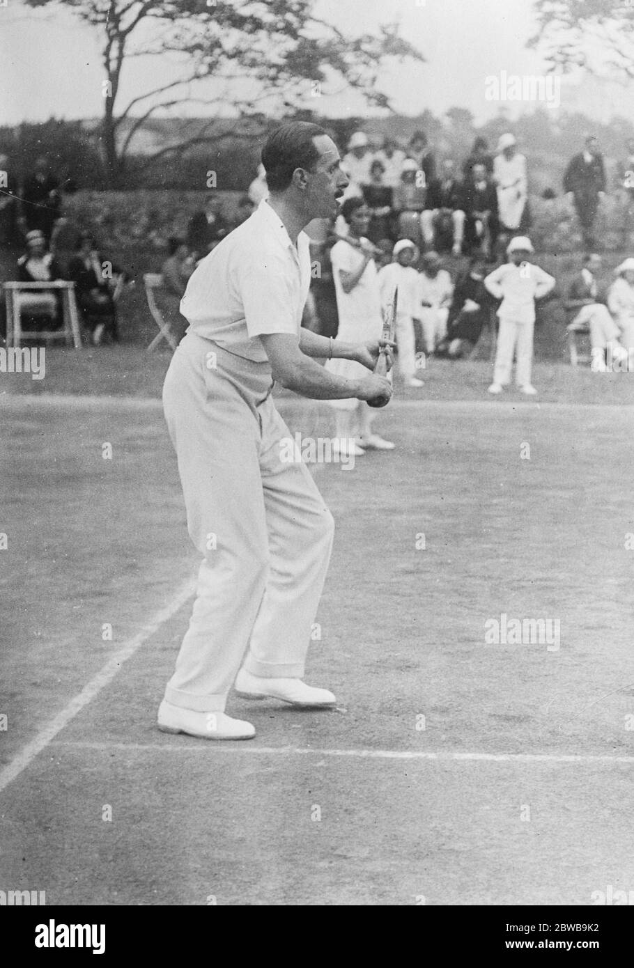 The Spanish Royal family on holiday at Santander . The King of Spain playing tennis in the grounds of the Royal Palace Magdalena . 21 August 1924 Stock Photo