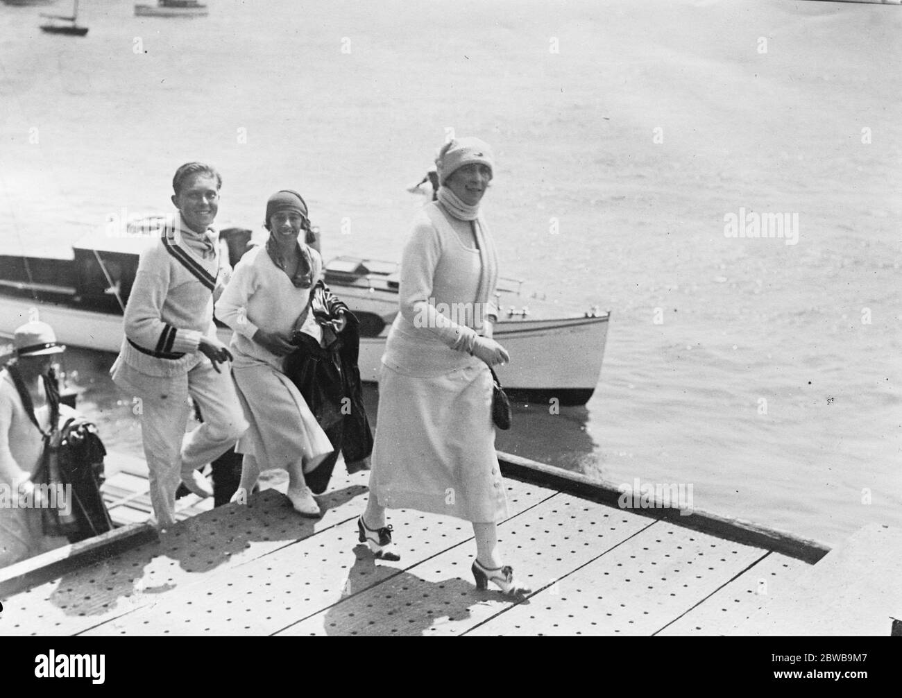 The Spanish Royal family on holiday at Santander . The Queen of Spain and the Duchess of Santona with the Prince of Asturias leaving Santander Bay after watching a regatta . 21 August 1924 Stock Photo