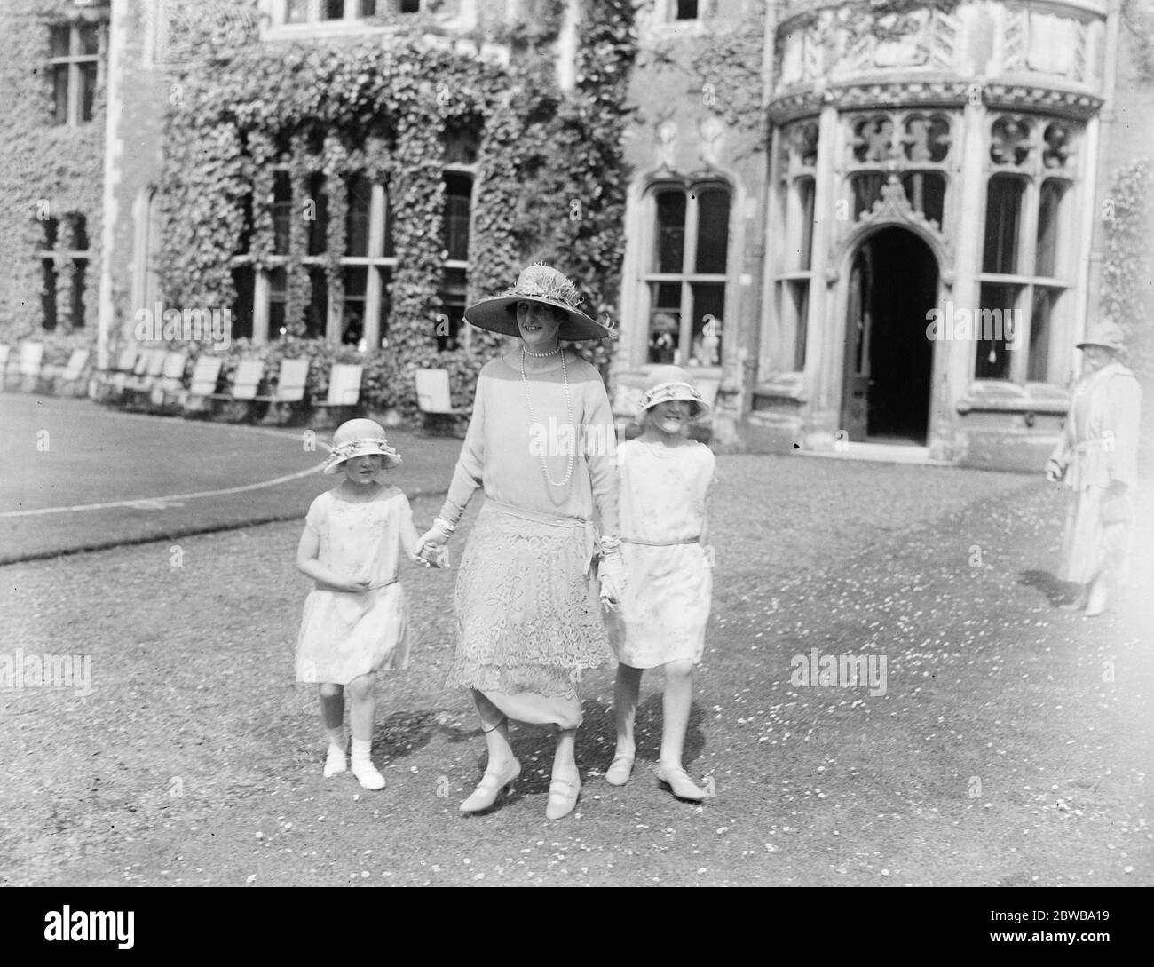 Little train bearers for Monday 's wedding . Lady Edward Grosvenor with her children at Lord and Lady Desborough 's garden party at Taplow Court . These little people will be trainbearers at the wedding of the Honourable Monica Grenfell and Air Marshal Sir John Salmond . 31 May 1924 Stock Photo