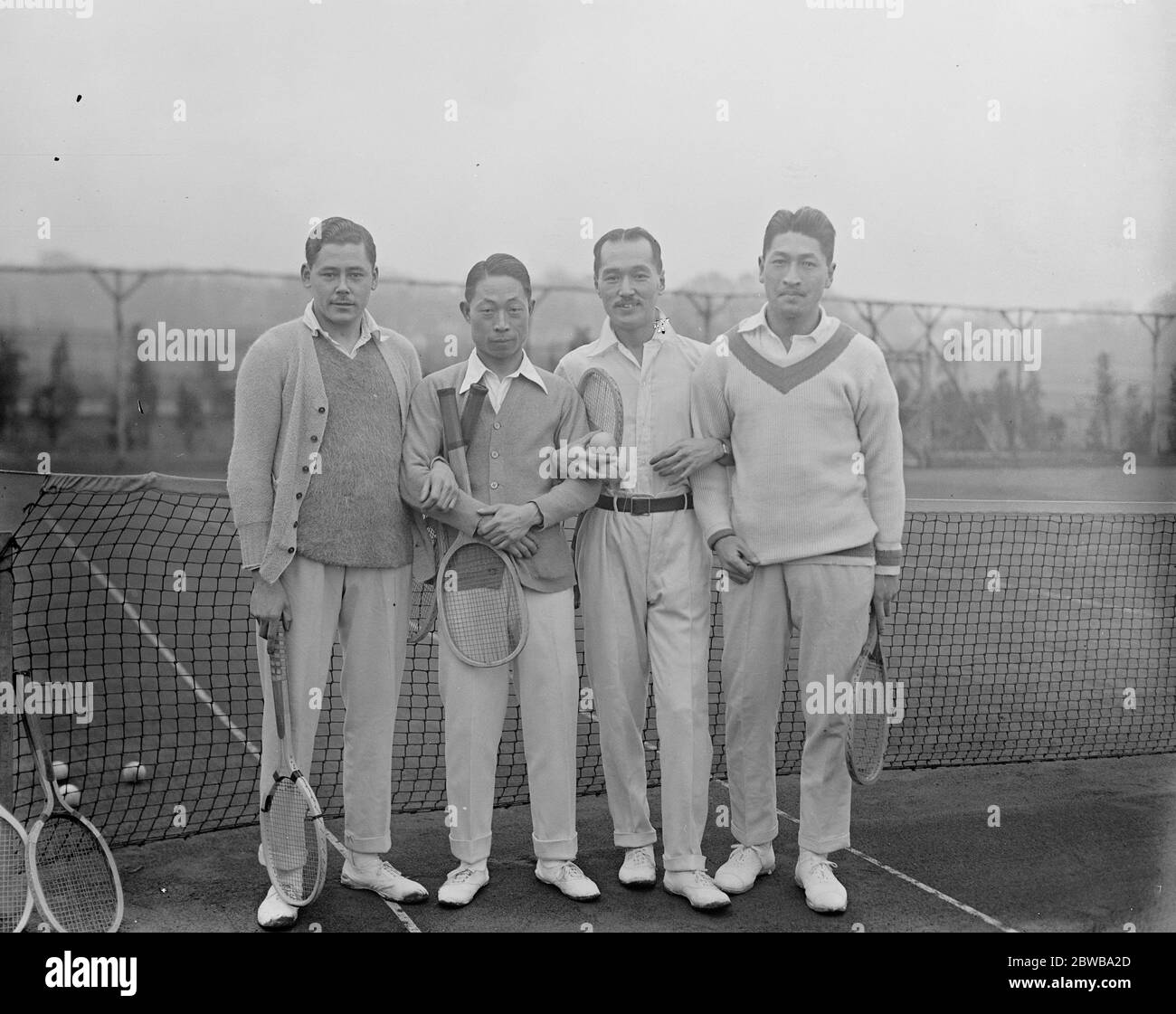 Japanese tennis players at practice at Hendon . The Japanese tennis team who oppose Surrey at Purley Bury were at practice at the London County Club at Hendon . Picture shows ; H Watanabe , S Imajo , K Yamamoto and H Iwasaki 26 January 1923 Stock Photo