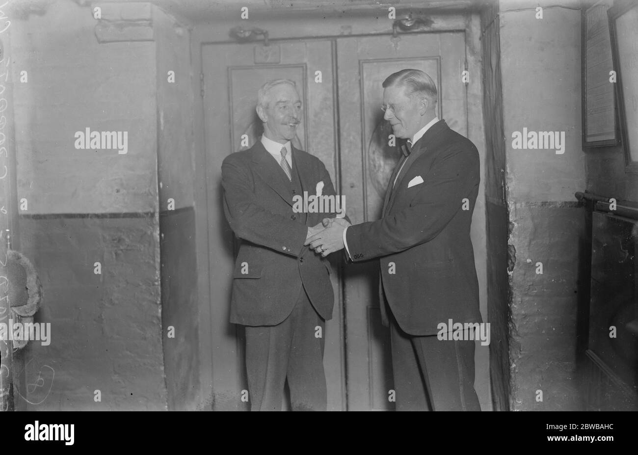 32 Years at a London stage door . Mr George Parrot , who has been stage doorkeeper at the Alhambra for nearly 32 years , celebrated his 60 th birthday on Sunday . Mr G F Reynolds , General manager of the ALhambra congratulating Mr George Parrott . 15 November 1924 Stock Photo