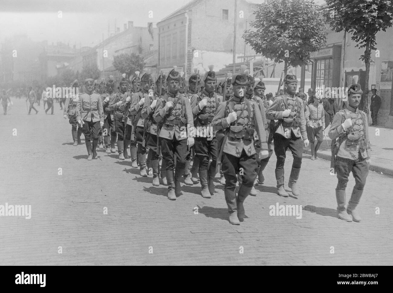 Preparing for the Royal Wedding at Belgrade . King Alexander of Serbia and Princess Marie of Romania are to be married at the cathedral in Belgrade on Thursday . The Royal Guard in their picturesque uniforms marching through the streets of Belgrade . 7 June 1922 Stock Photo