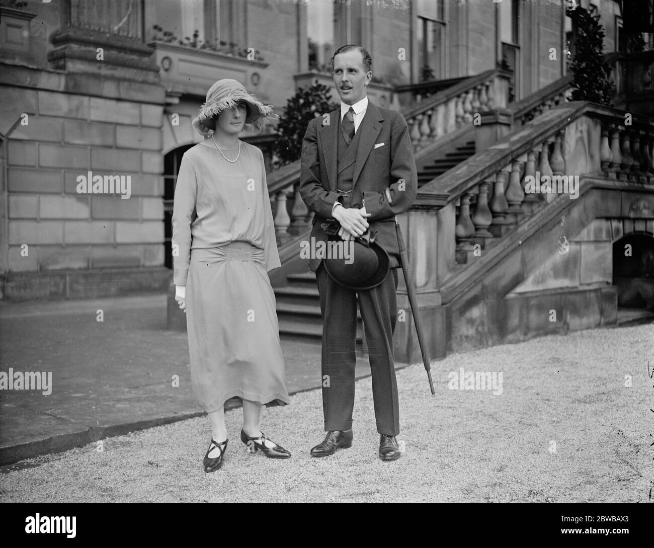 The garden party at Chatsworth House in connection with the wedding of Lady Rachel Cavendish . Lady Rachel Cavendish with her fiance , James Grey Stuart , 1st Viscount Stuart of Findhorn . 3 August 1923 Stock Photo