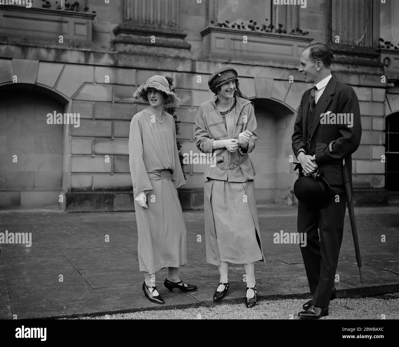 The garden party at Chatsworth House in connection with the wedding of Lady Rachel Cavendish . Lady Rachel Cavendish with her fiance , James Grey Stuart , 1st Viscount Stuart of Findhorn and Lady Hartington . 3 August 1923 Stock Photo