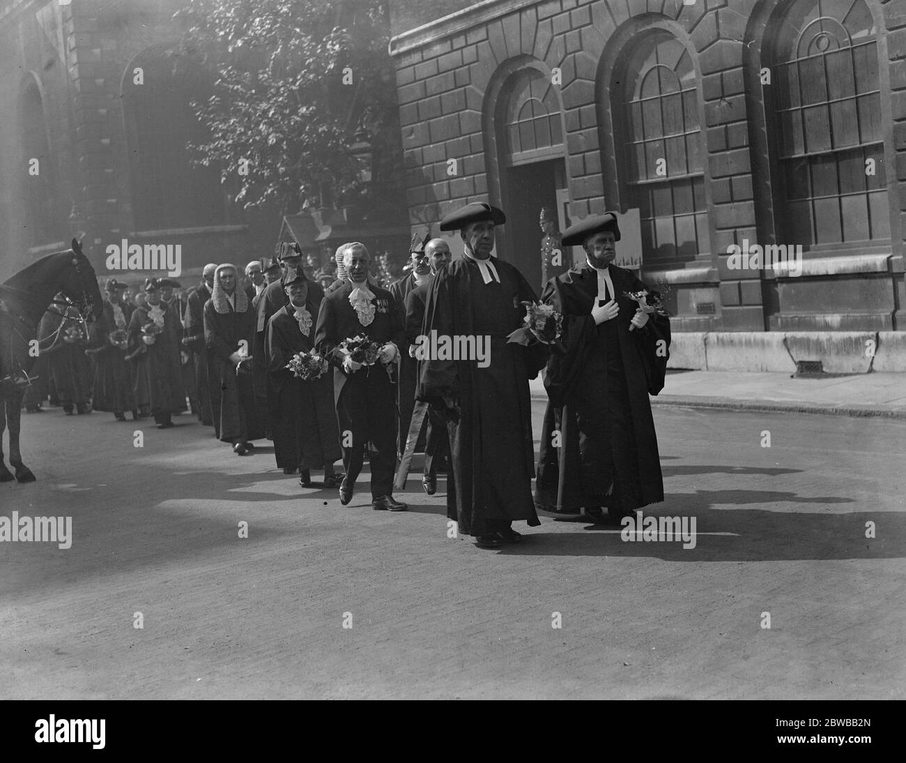 Election of the New Lord Mayor of London . Aldermen and Sheriffs carrying bouquets on their way to services at the Church of St Lawrence Jewry . 29th September 1936 Stock Photo