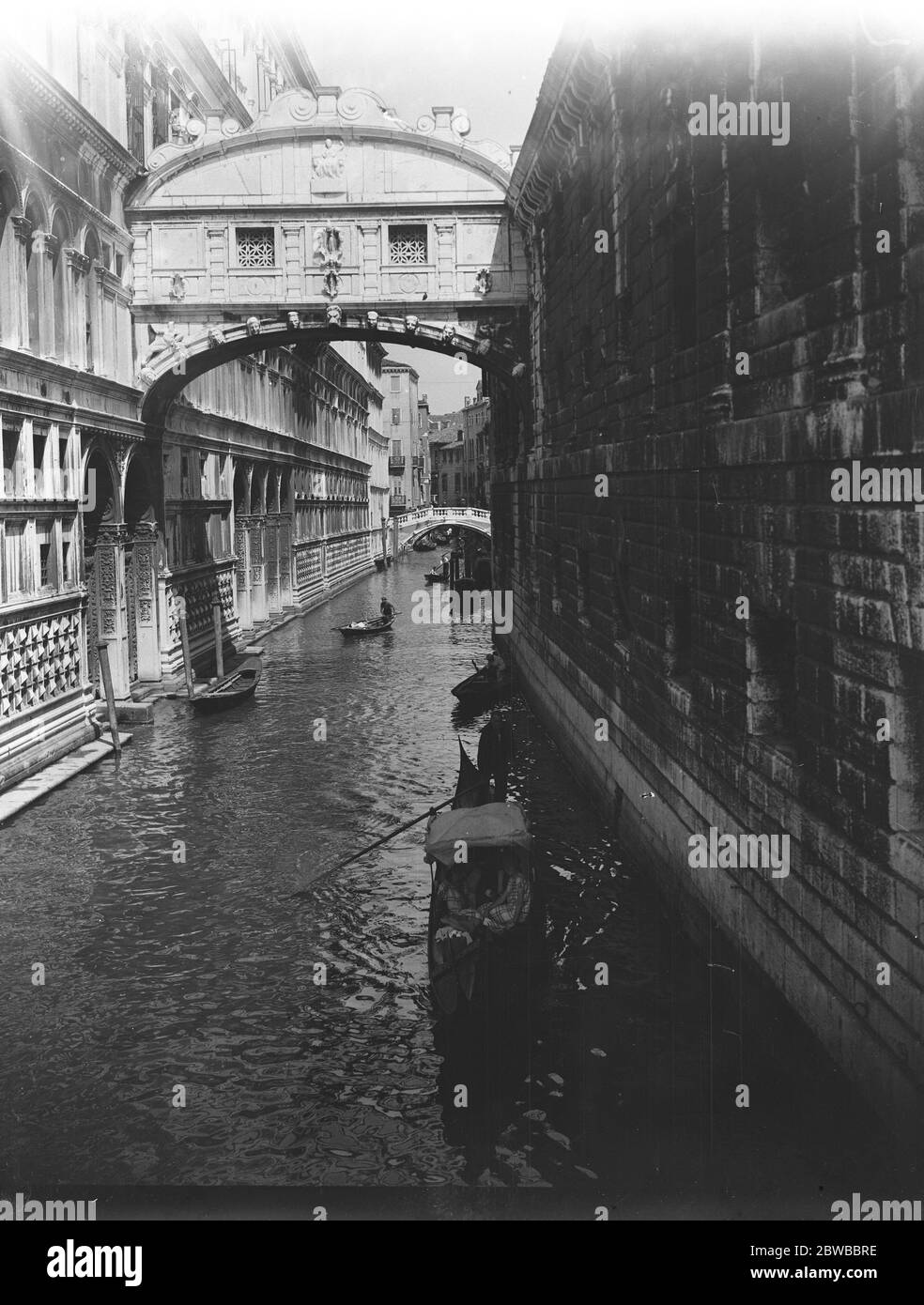 Venice ; gondolas making their way down the small canals . Stock Photo