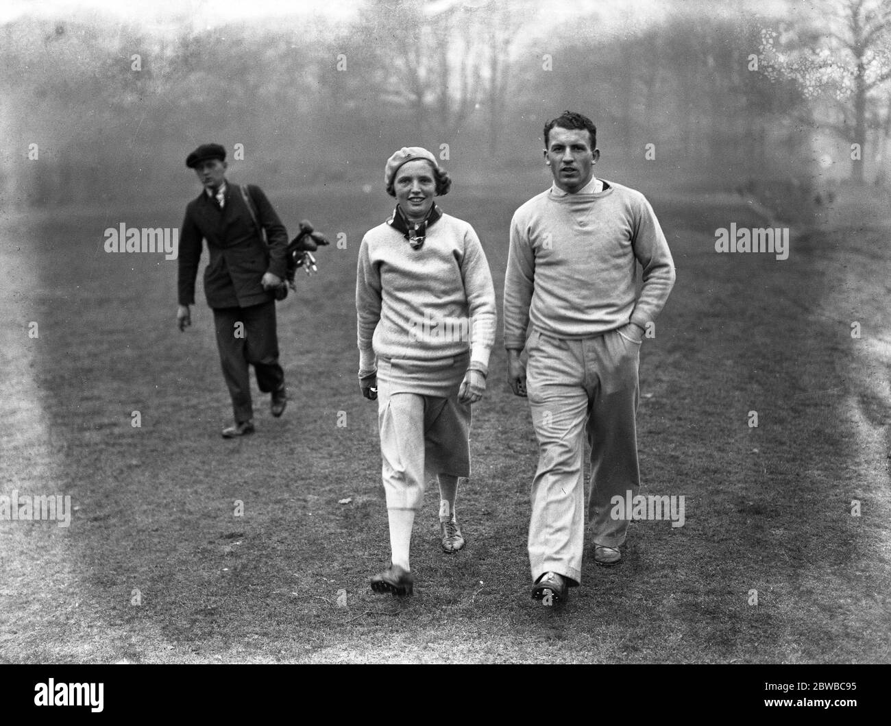 Miss Diana Fishwick 's Ladies v  The Outlaws  (Oxford University ) at Ashridge , Berkhamps Tead . Miss Diana Fishwick and K C Fyfe , the Scottish international and Cambridge rugby player . 1935 Stock Photo
