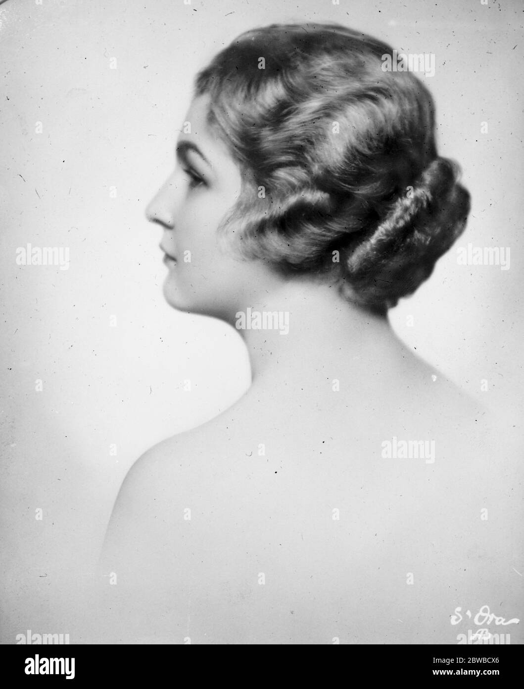 Beauty and her  Bun  . Mlle Maria Schuster , daughter of Dr Schuster of Vienna , who has inherited a life interest in her father 's estate of £80,000  so long as she refrain from either bobbing or shingling her hair  . 11 March 1927 Stock Photo