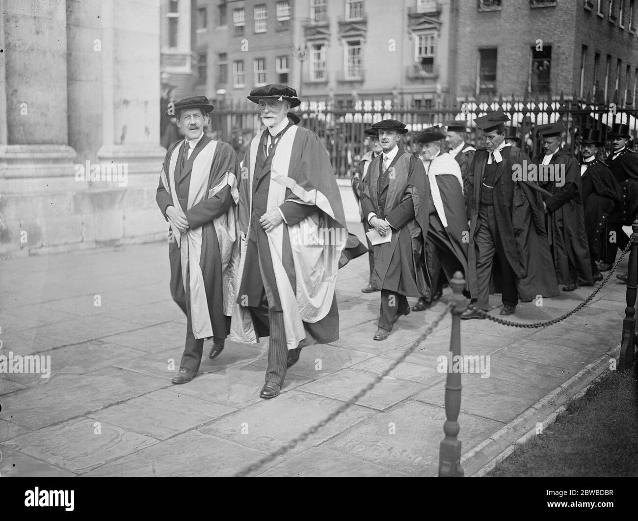 Honoury Degrees conferred at Cambridge . Honorary degrees were conferred at Cambridge University in connection with the ceremonial opening of the Marley extension to the Fitzwilliam museum . The procession to the Senate House . The Duke of Rutland on the right , next to him is Earl Crawford . Behind Lord Crawford is Sir Charles John Holmes . 18 June 1924 Stock Photo