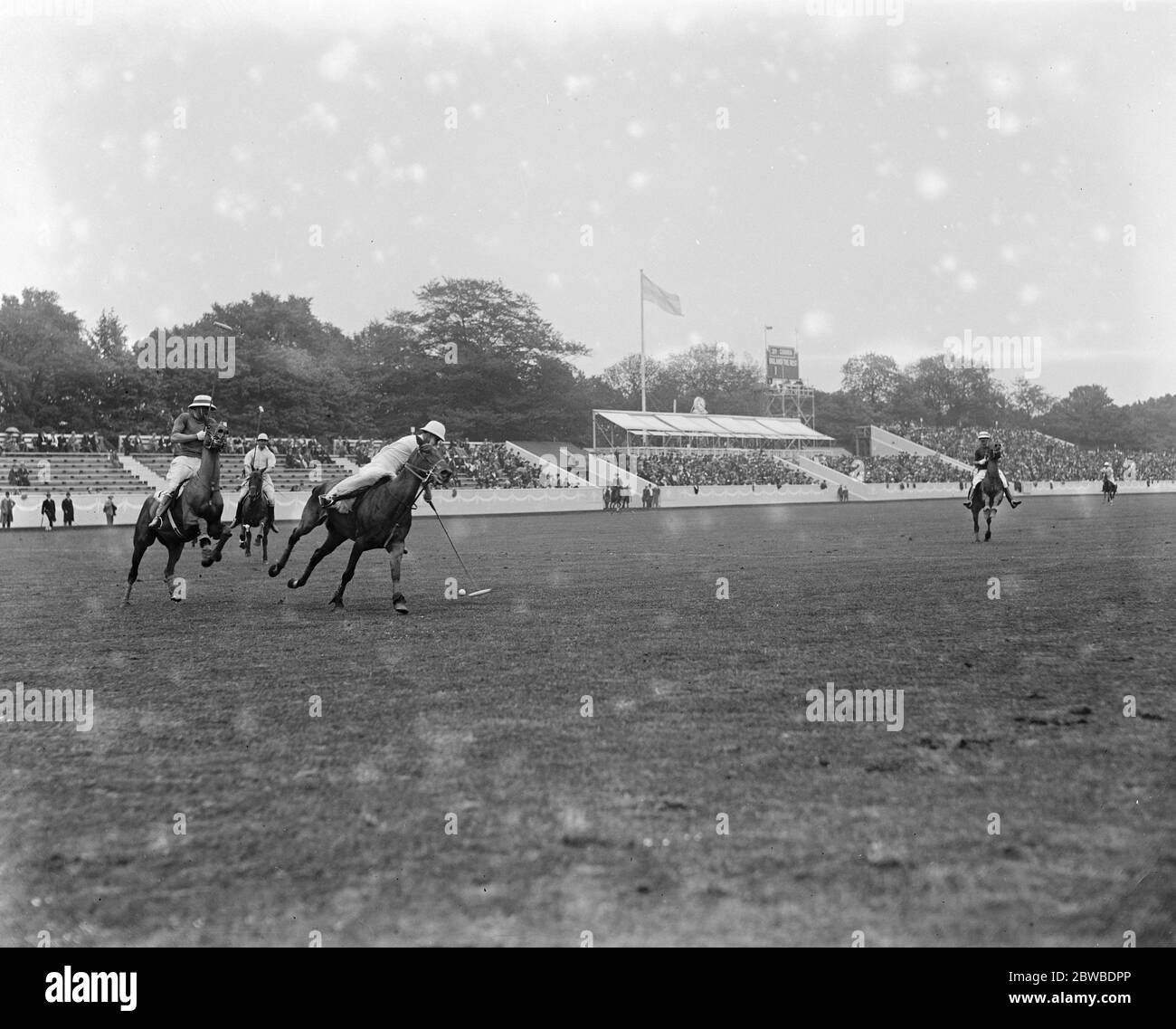 Polo at the Hurlingham Club - one of the players clearing his goal . 1921 Stock Photo