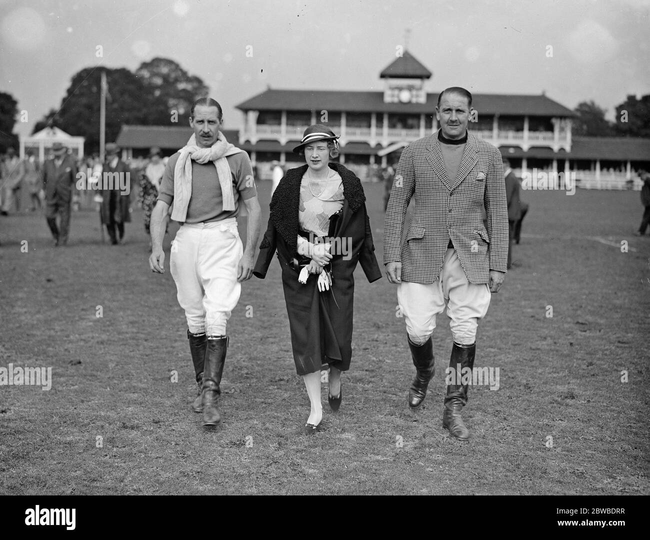 Ranelagh farm polo club . Final of the Kings Coronation Cup Final Left to right - ; Captain C T Roark , Mrs and Major Jack Harrison 23 July 1932 Stock Photo