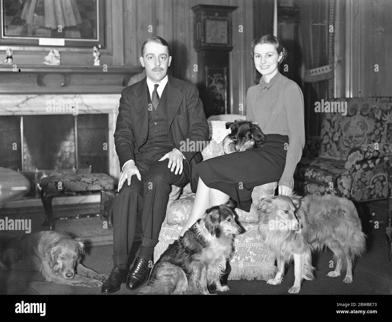 Viscount Cowdray with his fiance , Lady Anne Bridgeman , pictured with their pet dogs . 18 January 1939 Stock Photo