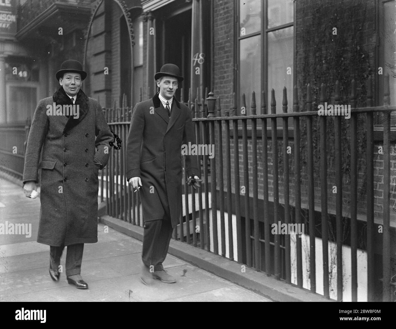 Midshipman Prince for British Navy . King of Romania ' s younger son in London Prince Nicholas of Romania ( right ) walking with H E Mons Nicolas Titulesco , the Romanian minister in London Prince Nicolas is the younger son of the King of Romania and is to enter the British Navy as a Mid Shipman 17 February 1923 Stock Photo