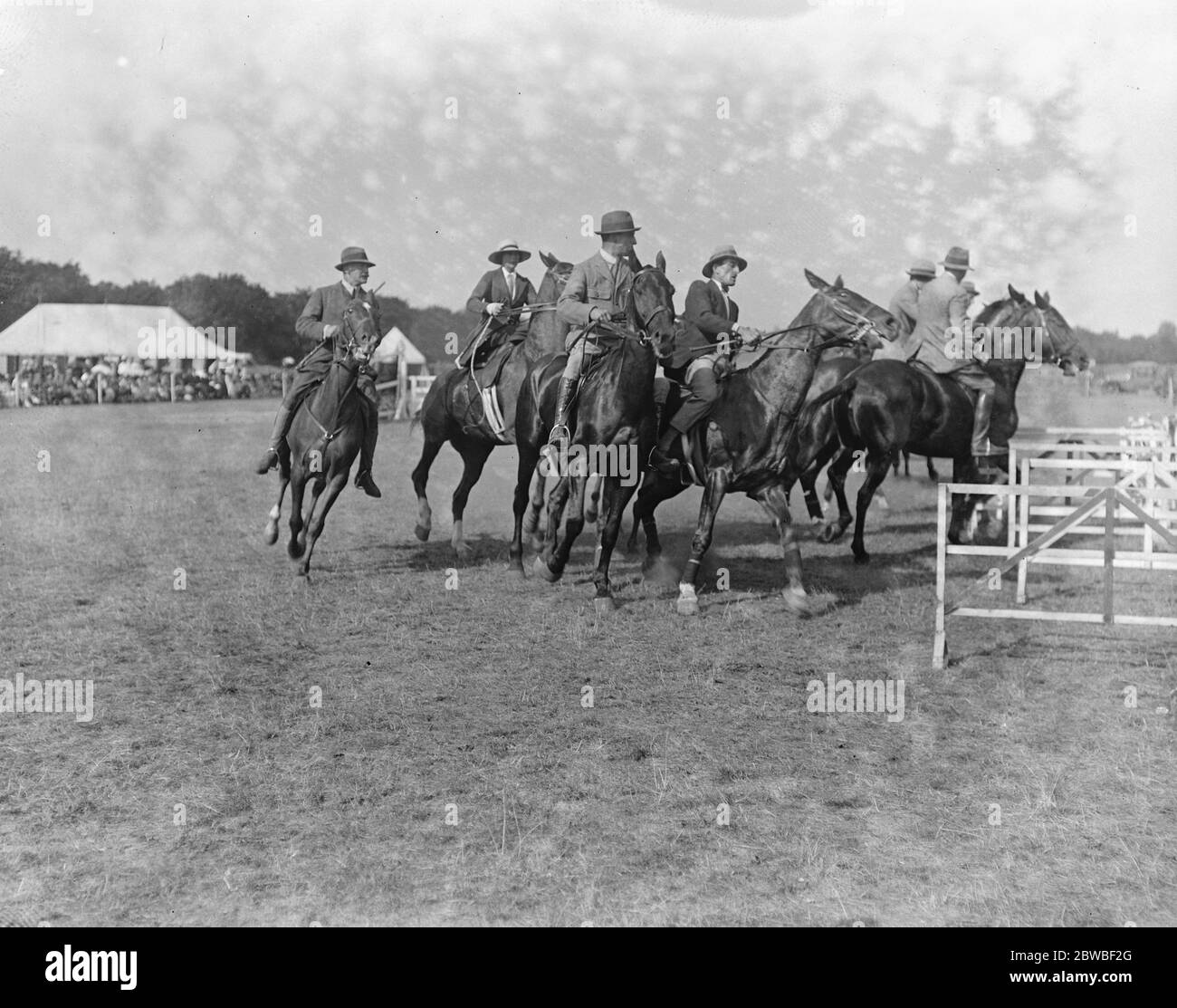 Aldershot Polo Gymkhana Ladies and gentlemen , musical chairs A Hussar of 1685 and a modern hussar 16 August 1919 Stock Photo