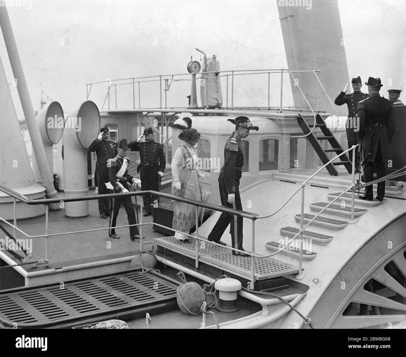 King and Queen of Denmark at Port Victoria . King Christian , Queen Alexandrine and Prince of Wales disembarking . Stock Photo