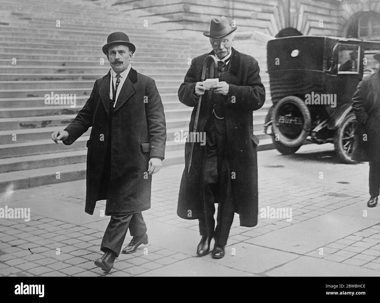 Ernest Judge before the French Magistrates M Ernest Judet ( right ) who is charged with communicating with the enemy during the war , leaving the Palais de Justice , Paris after appearing before the examining magistrate 5 March 1923 Stock Photo