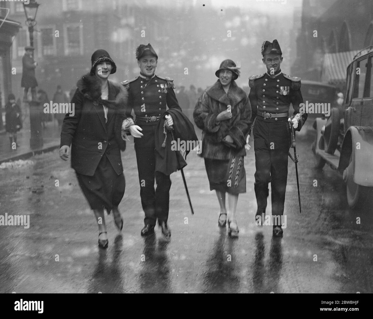 Wedding of Lieutenant the Hon Robert W A Southwell Royal Navy and Miss Violet Mary Weldon Walshe at St Marys Catholic Church , Cadogan Street ( Left to right ) Lieutenant and Mrs Longsdon , Lieutenant Commander and Mrs Farquhar Smith Stock Photo