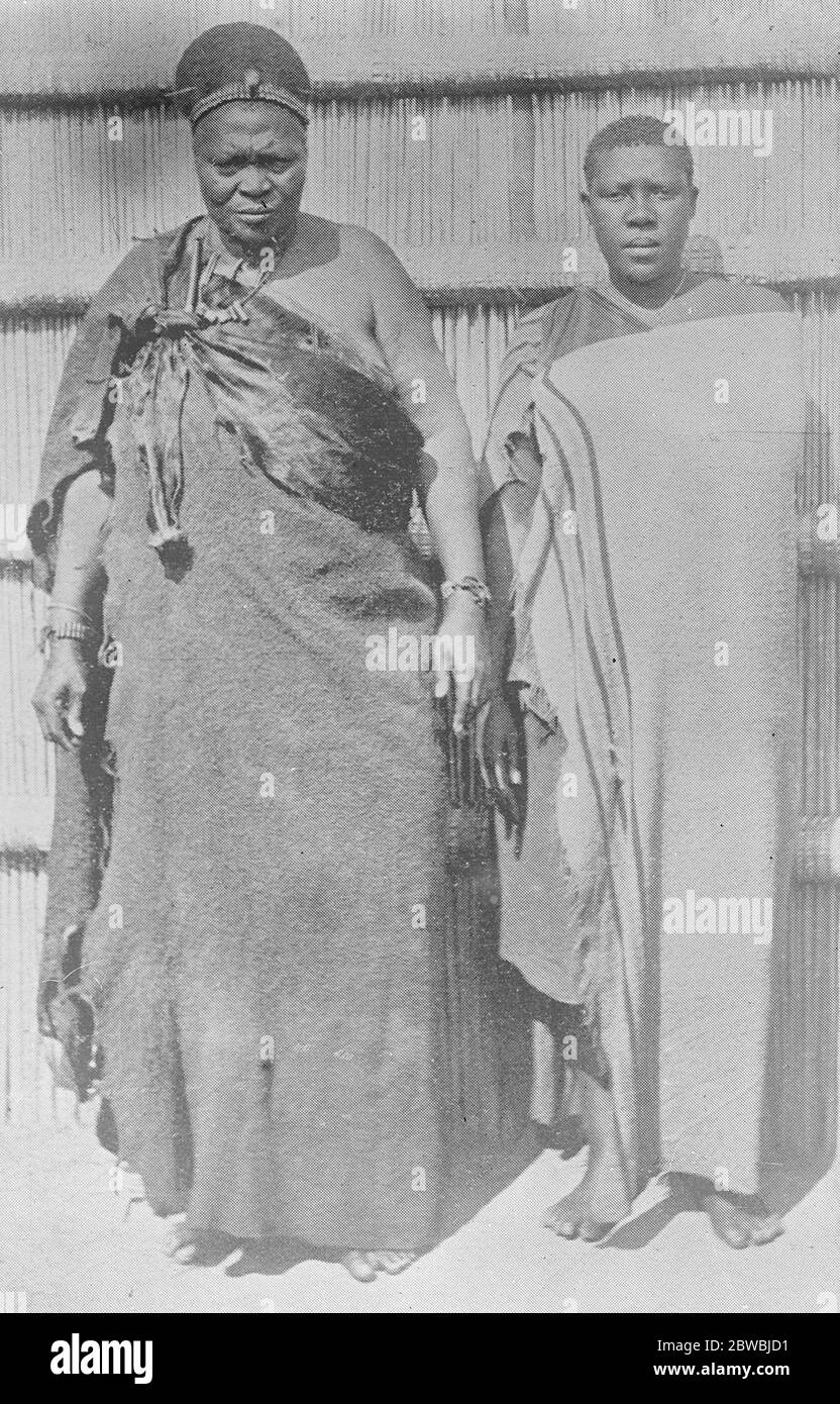 Queen Regents Rain Making Secret The Ex Queen Regent Labotsibeni of Swaziland who has not been consented to hand over to Sobhuza , the ruler designate , the secret of rain making , without knowledge of which the cheif could not be crowned . The cheif Sobhuza is seen standing beside her  23 September 1922 Stock Photo