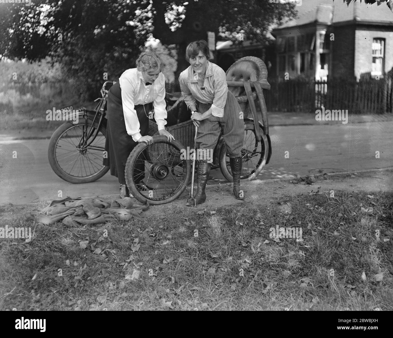 Miss Sybll Arundale and Miss Betty Fairfax out for a motor cycle trip Pumping Up Stock Photo