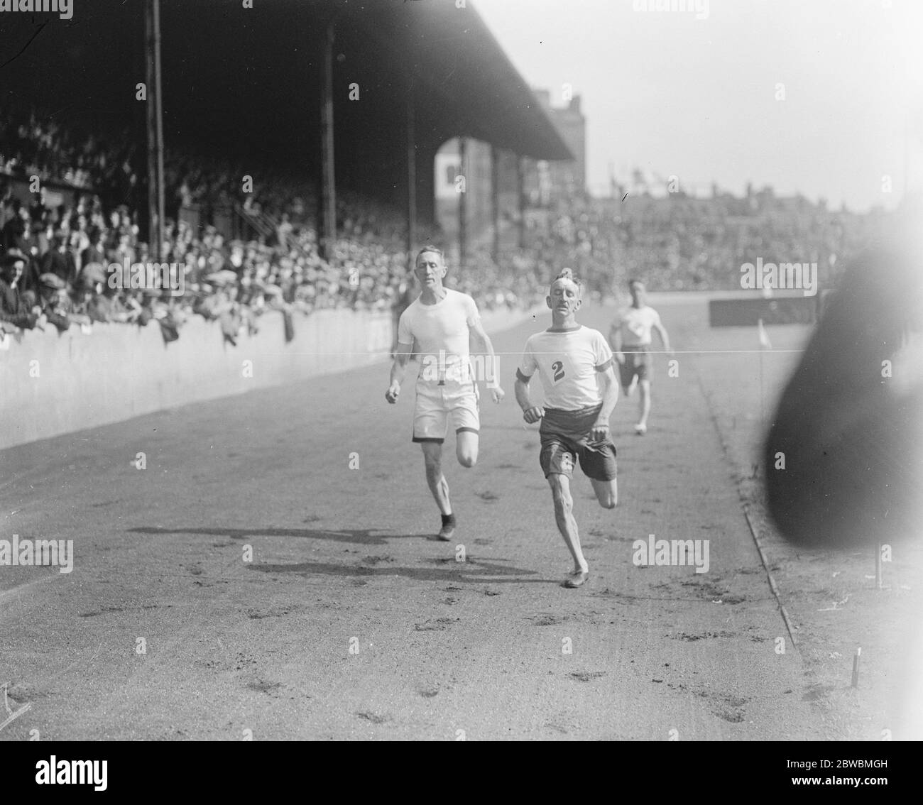 London Fire Brigade Athletics Meeting at Stamford J T Garlick wins the 400 yards Veteran race ( over 40 years of age )   13 August 1921 Stock Photo