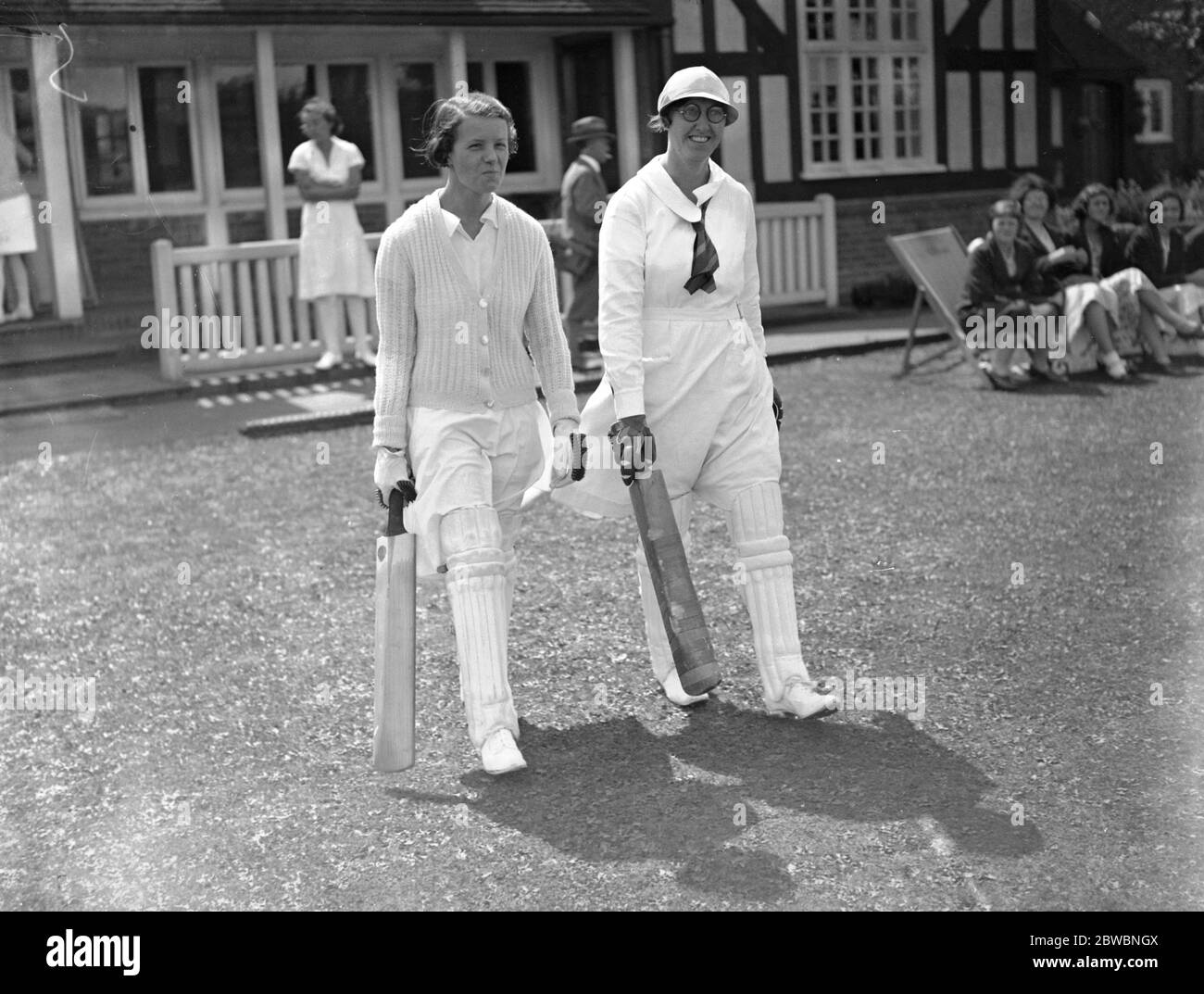 The ' South ' versus ' The Rest of the South ' at the Women ' s cricket trial at New Beckenham . Miss F Hurst and Miss TG Threlford ( glasses ) coming out to bat . 17 June 1933 Stock Photo
