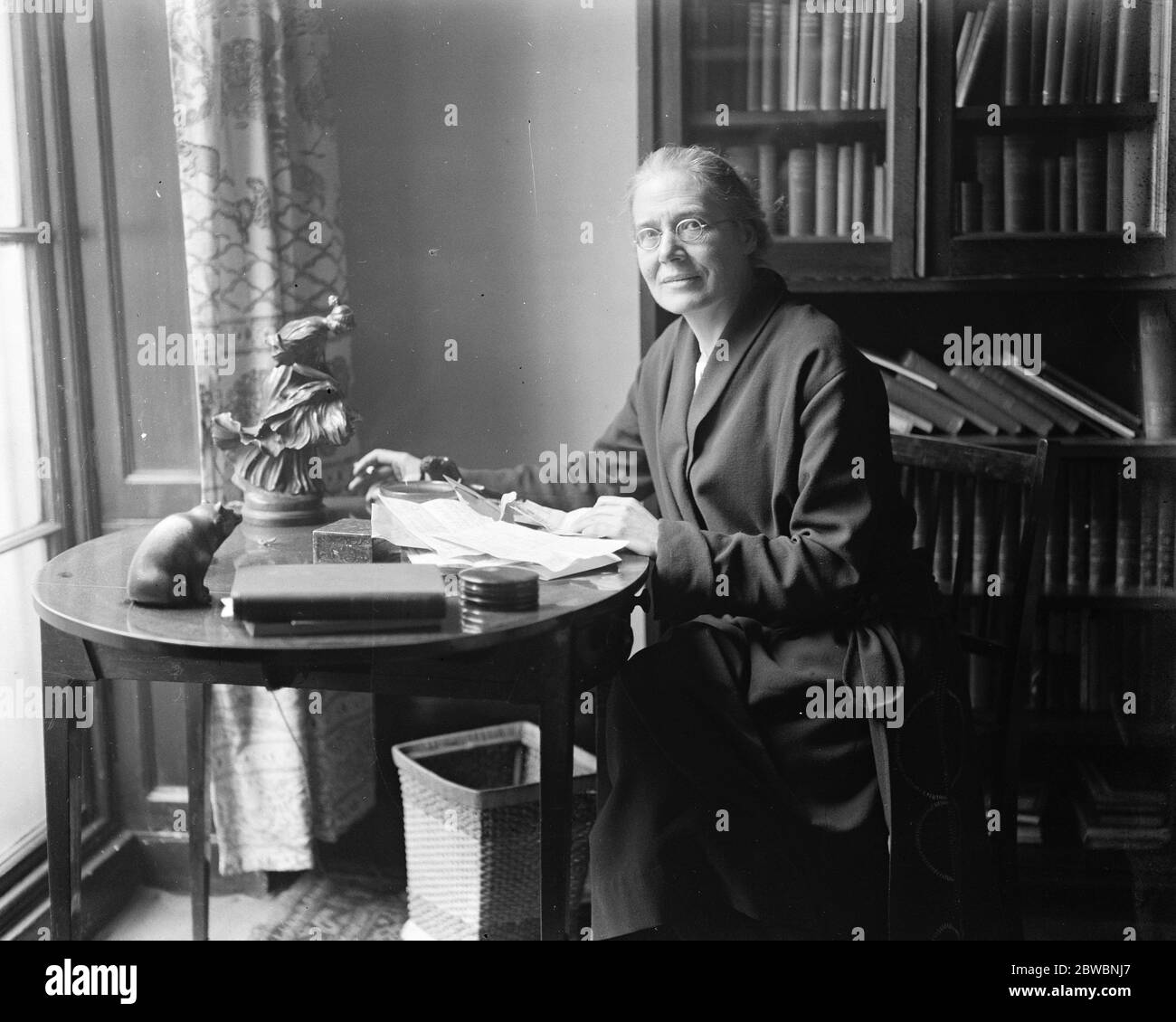 First woman Labour MP receives congratulations . Miss Susan Lawrence , the first woman Labour MP to be returned , reading telegrams of congratulations at her London residence . 7 December 1923 Stock Photo