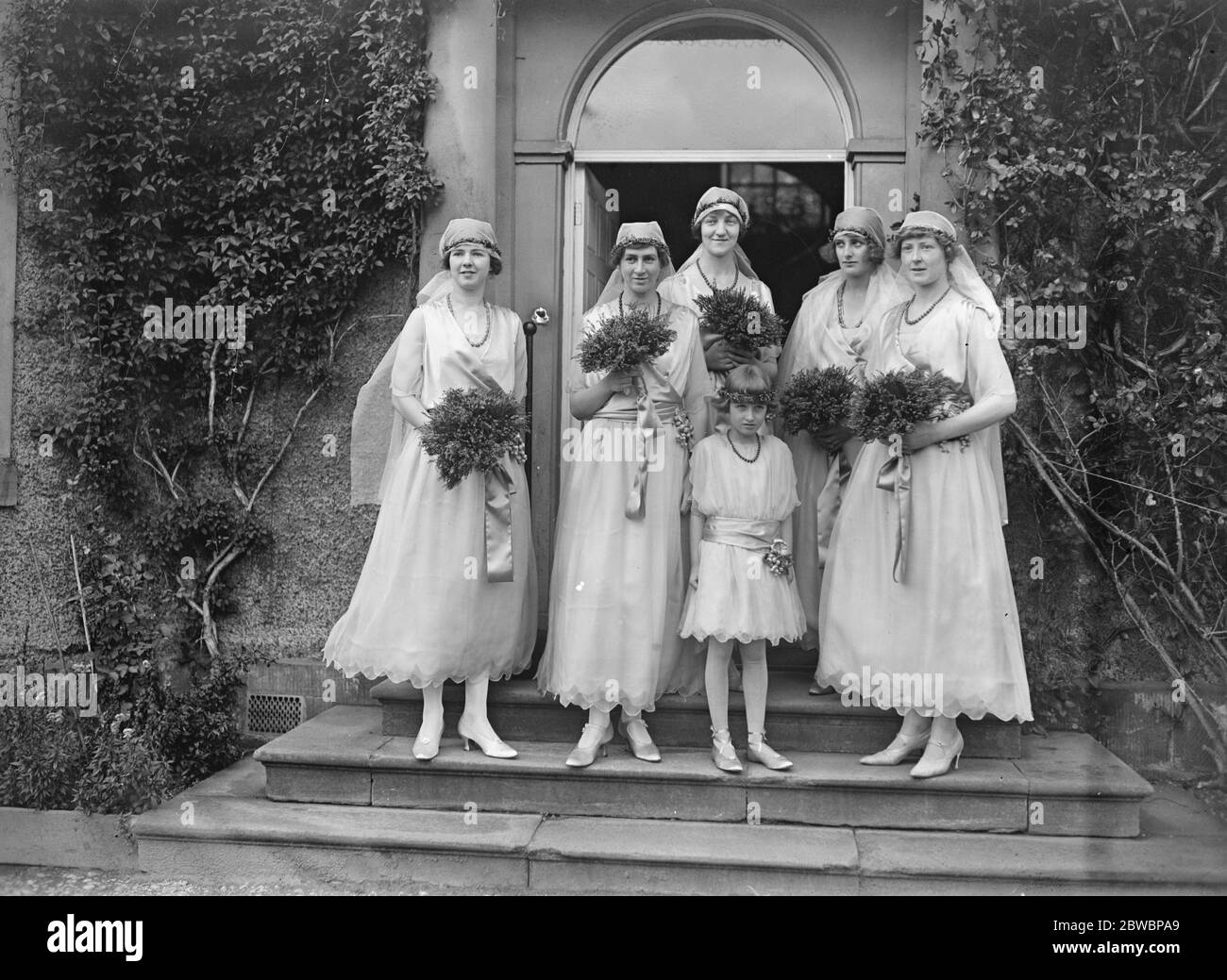 Bishop of Kingston married to the Hon Elaine Orde Powlett at Wensley . The bridesmaids - left to right : Lady Hermione Herbert , Miss Erica Gibson , Miss Catherine Talbot , Lady Winifred Cecil , Miss Beatrice Thynne . The little trainbearer in front is Lady Romayne Cecil . 19 September 1922 Stock Photo