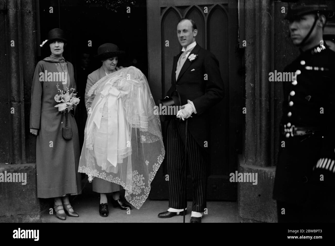 Infant daughter of Sir John and Lady Dashwood Christened The Queen of Norway was a godmother to the infants daughter of Sir JOhn and Lady Dashwood , christened at St Margaret ' s , Westminster Sir John and Lady Dashwood with the nurse and baby 7 May 1924 Stock Photo