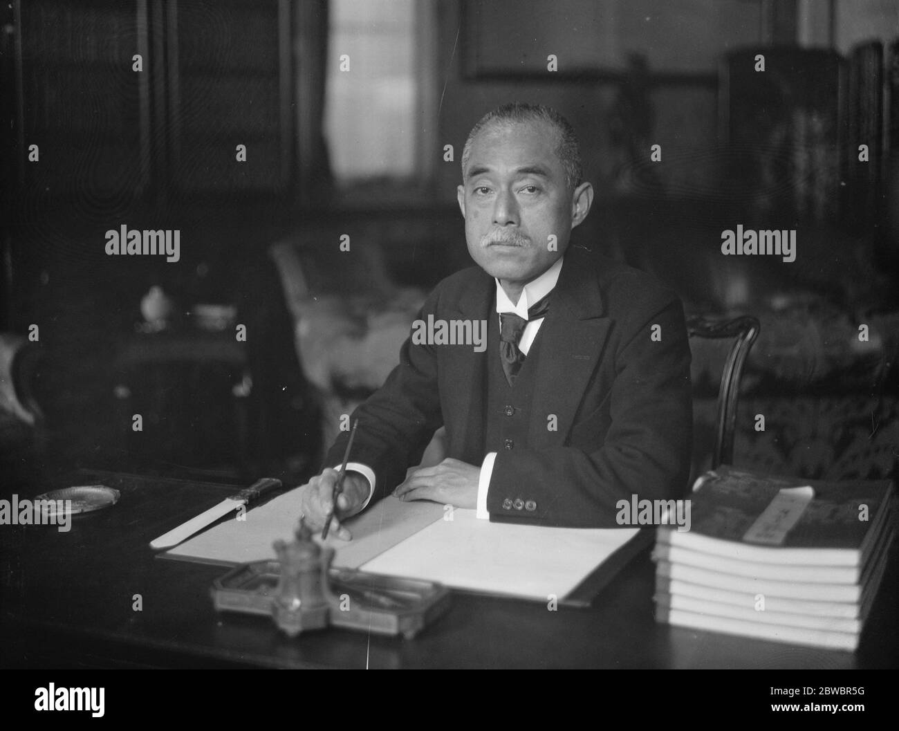 Baron Matsui posed at desk . 1925 Stock Photo