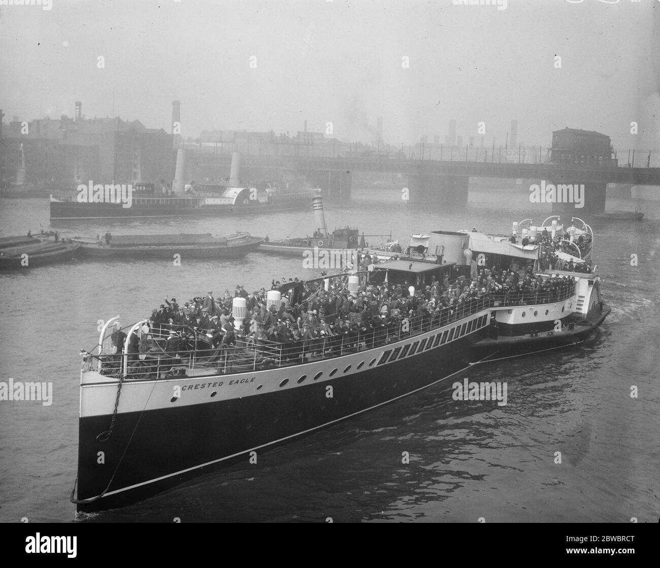 Royal Sovereign held up for coal . Margate trippers saved by oil burning ' Crested Eagle ' . The ' Crested Eagle ' leaving Old Swan Pier . In the background the ' Royal Sovereign ' is seeat her moorings . 22 May 1926 Stock Photo