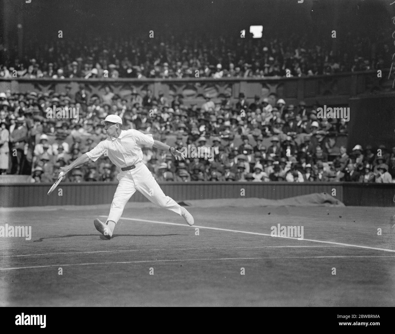 Final of the men 's lawn tennis Championships . Borotra defeated Lacoste in the final of the men 's singles in the world 's lawn tennis championships at Wimbledon on Saturday . Lacoste in play . 5 July 1924 Stock Photo