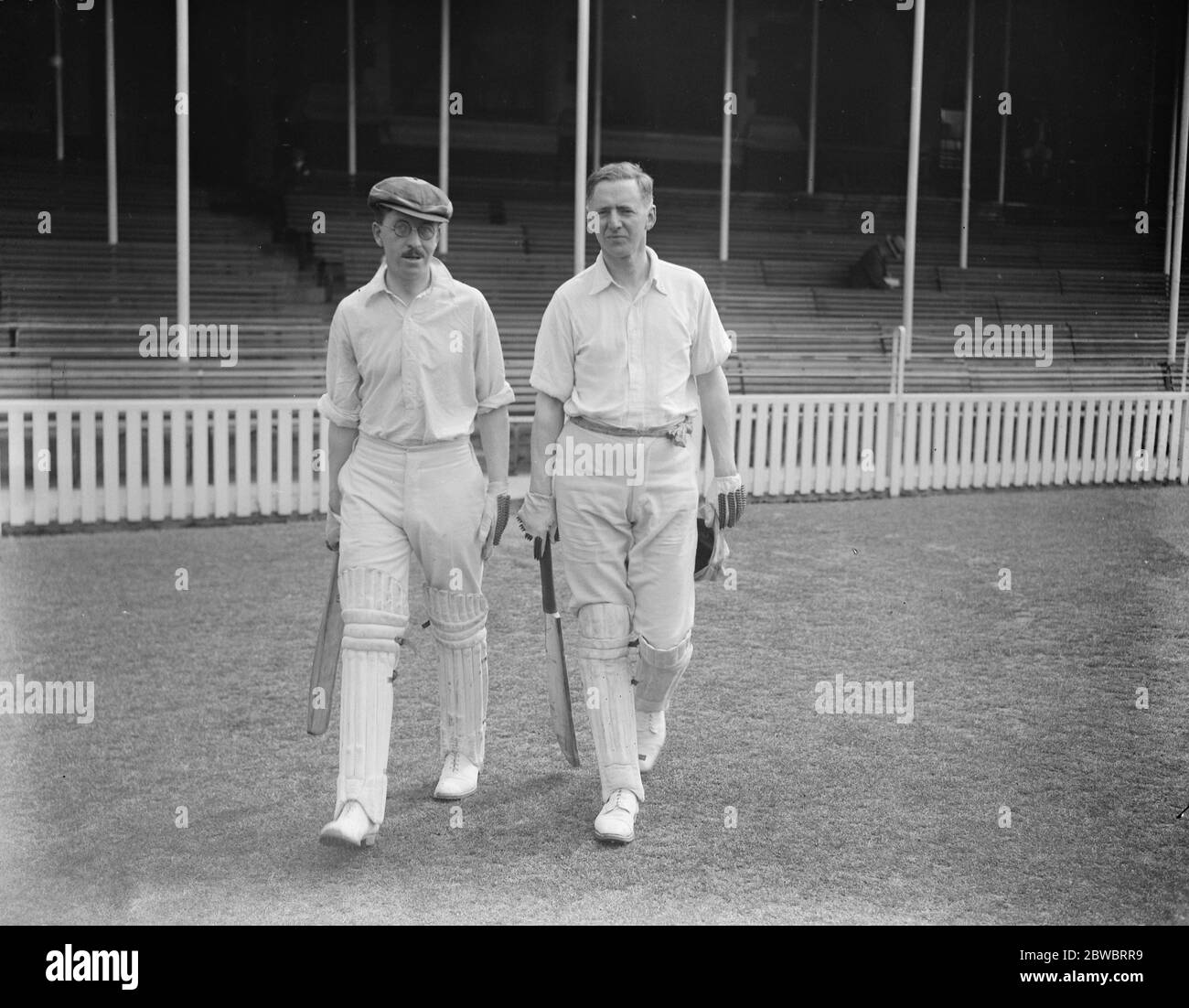 Parliamentary cricket at the oval . House of Commons team V  Invalids Club  . Mr M R K Burge ( left ) and Mr Clifford Bax going in to bat for the  Invalids Club  . 29 May 1924 Stock Photo