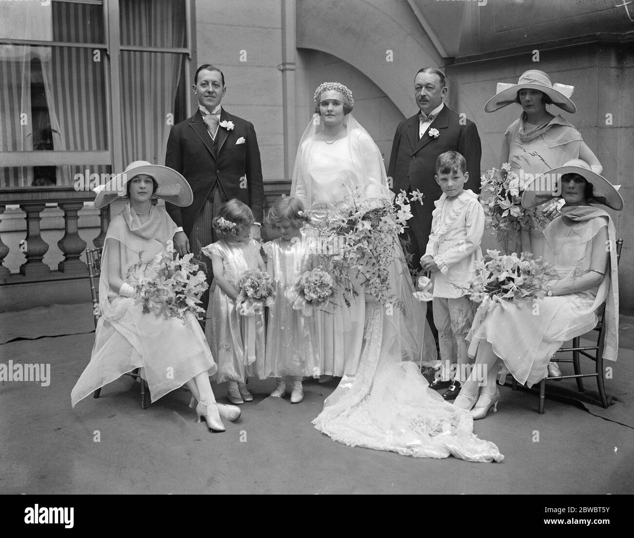 Lady Latta 's daughter weds . Miss Mary Latta and Count de Crameyel were married at St James 's , Spanish Place . Bride and bridegroom with the bridesmaids , page and best man . 22 July 1924 Stock Photo