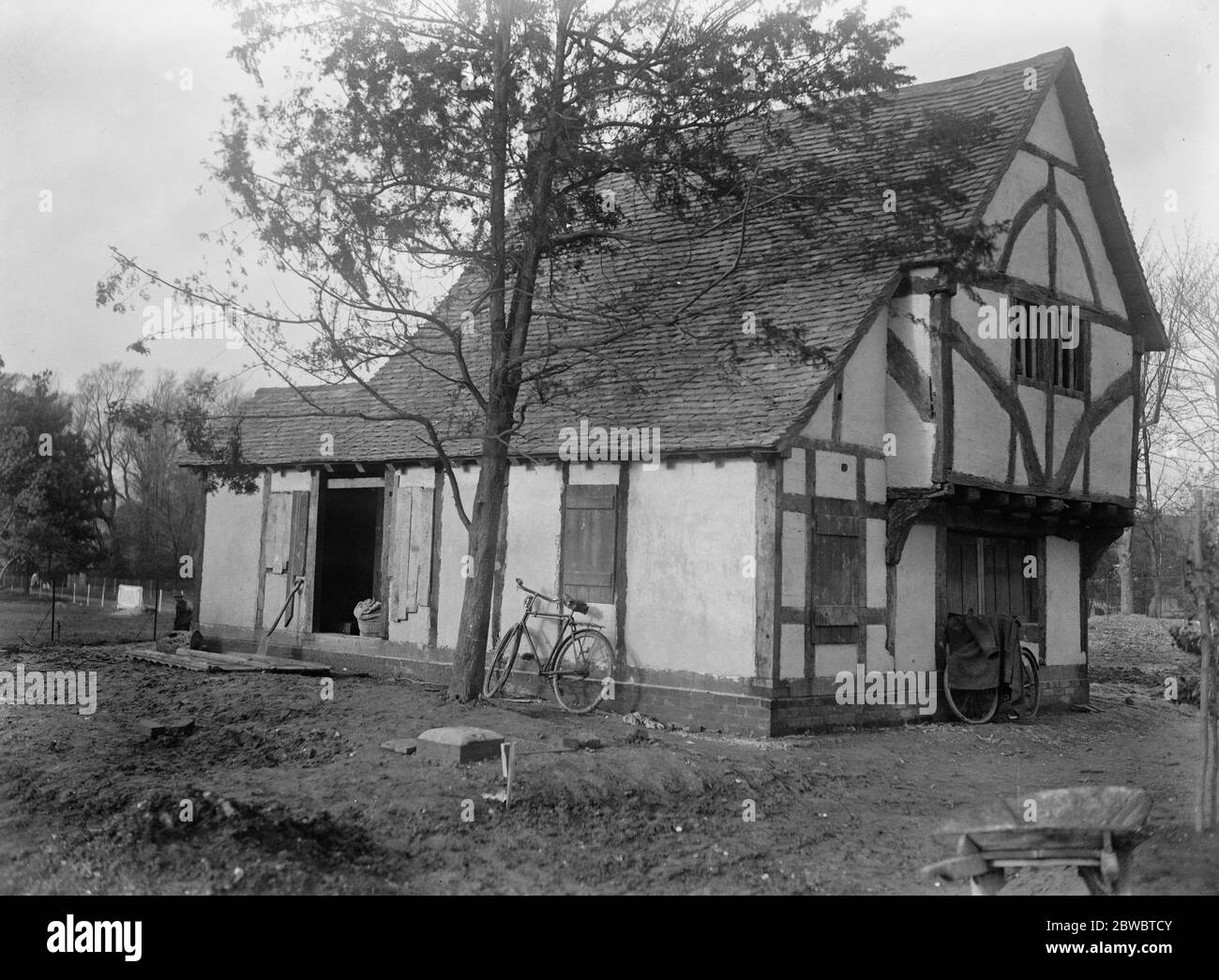 Fight for 600 year old cottage . Owing to the public spirit of the Epsom Council , the historic pre Tudor cottage at Cheam , has been saved from the American market and is to be preserved as a public building and used as Parish Council Offices at Cheam The 600 year old structure has had to be moved a distance of 50 yards , owing to improvements in the neighbouring highway . The task is just being completed and skilled workmen are replacing the massive oaken beams of the interior 5 January 1923 5 January 1923 Stock Photo