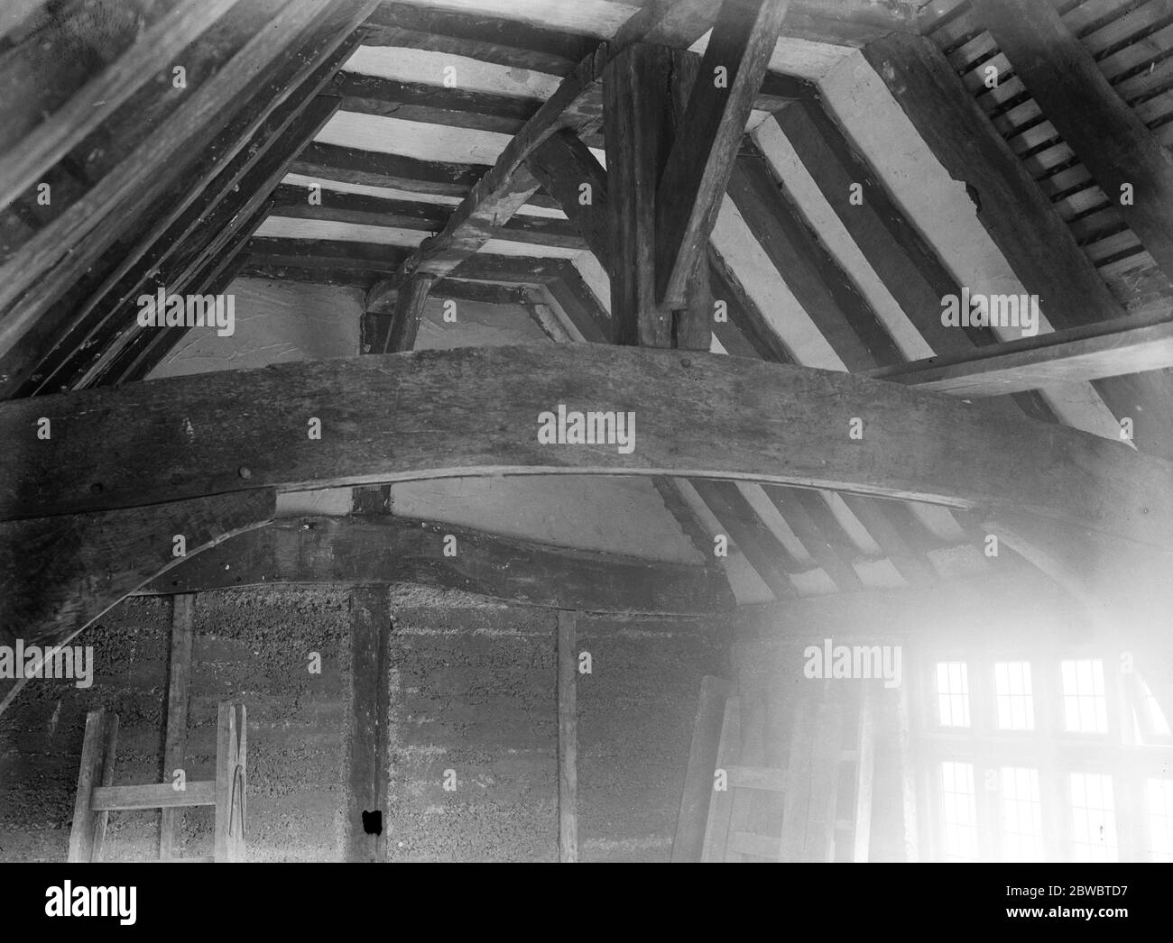 Fight for 600 year old cottage . Epsom Rural District Council out bid America The interior of the roof structure , showing the immense strength of the timbers 5 January 1923 Stock Photo