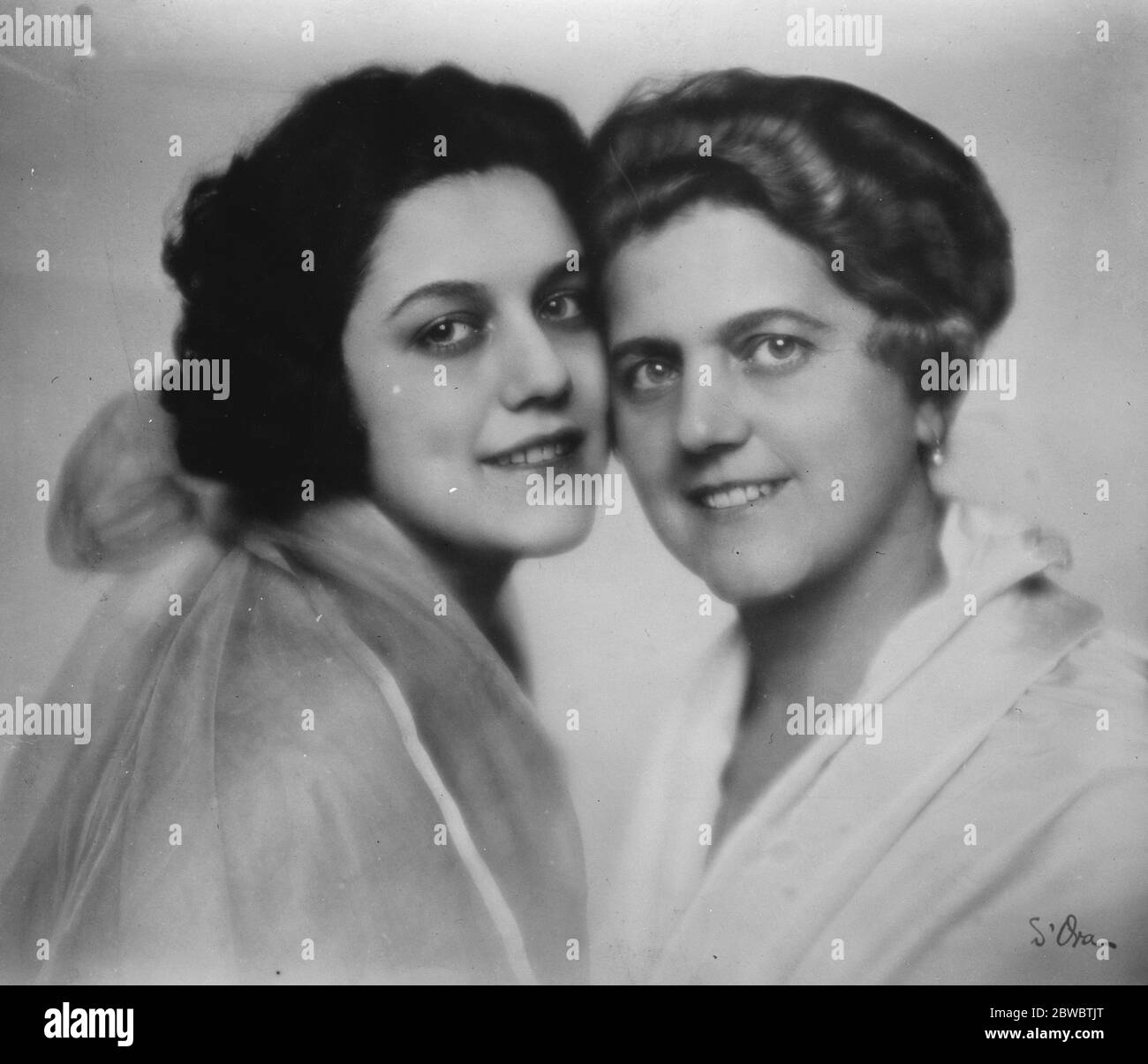 Noted Italian medical woman and her daughter marry on the same day . Dr Colombo ( right ) with her daughter Maria , whose double wedding at Milan has been the social event of the week in Italy . Dr Colombo is the widow of well known explorer and the bridegrooms brothers named Bessolini , are well known in diplomatic circles 23 March 1926 Stock Photo