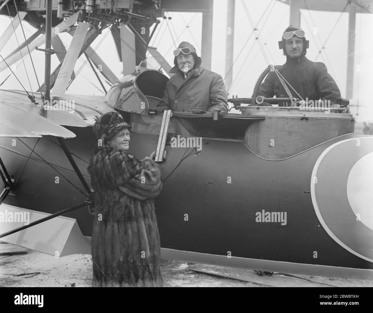 Launch of new Australian supermarine napier flying boat ' Seagull 'at Southampton . Sir Joseph Cook with the pilot just before the flight . Lady Cook is seen breaking the bottle of champagne on the bows of the flying boat . 6 February 1926 Stock Photo