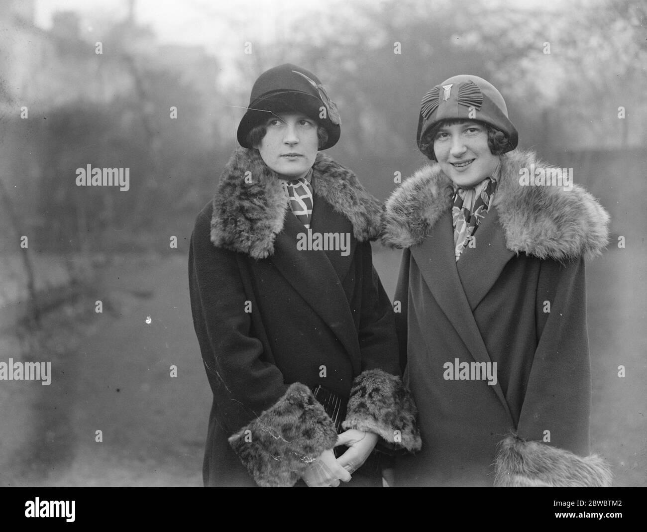 Twin daughters of Mr F O Salisbury , the painter , agree to differ . Monica Spares her tresses , Sylvia Bobs her hair . 12 December 1925 Stock Photo