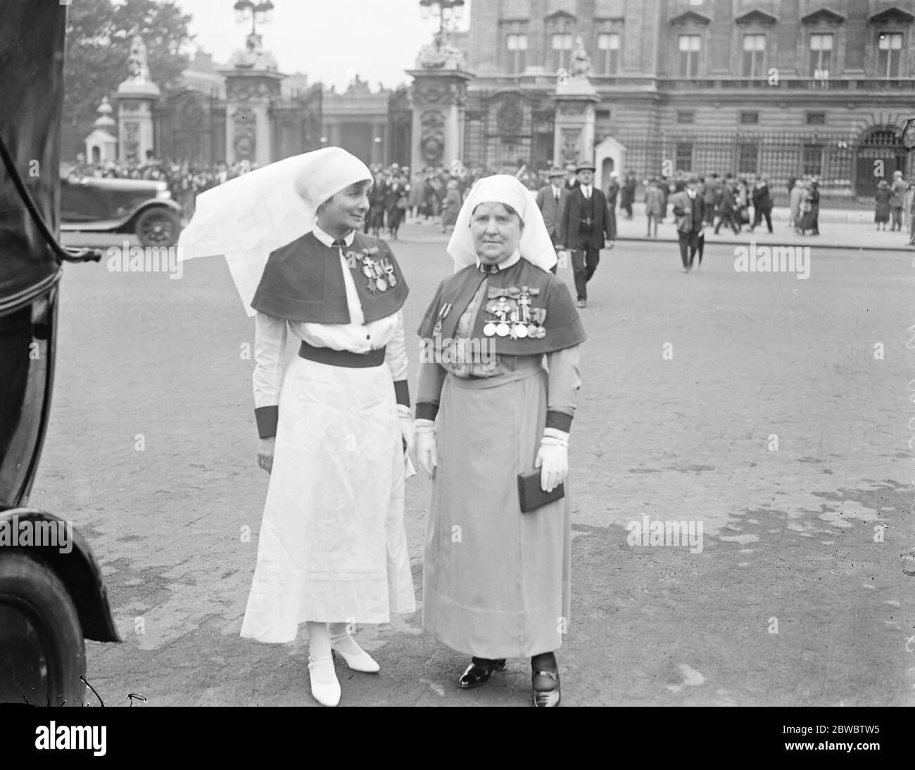 King holds investiture at Buckingham Palace . Matron in Chief Florence Hodgins ( left ) of the Army Nursing Service , and Miss M MacLean , of Indian Nursing Service , leaving . 4 July 1925 Stock Photo