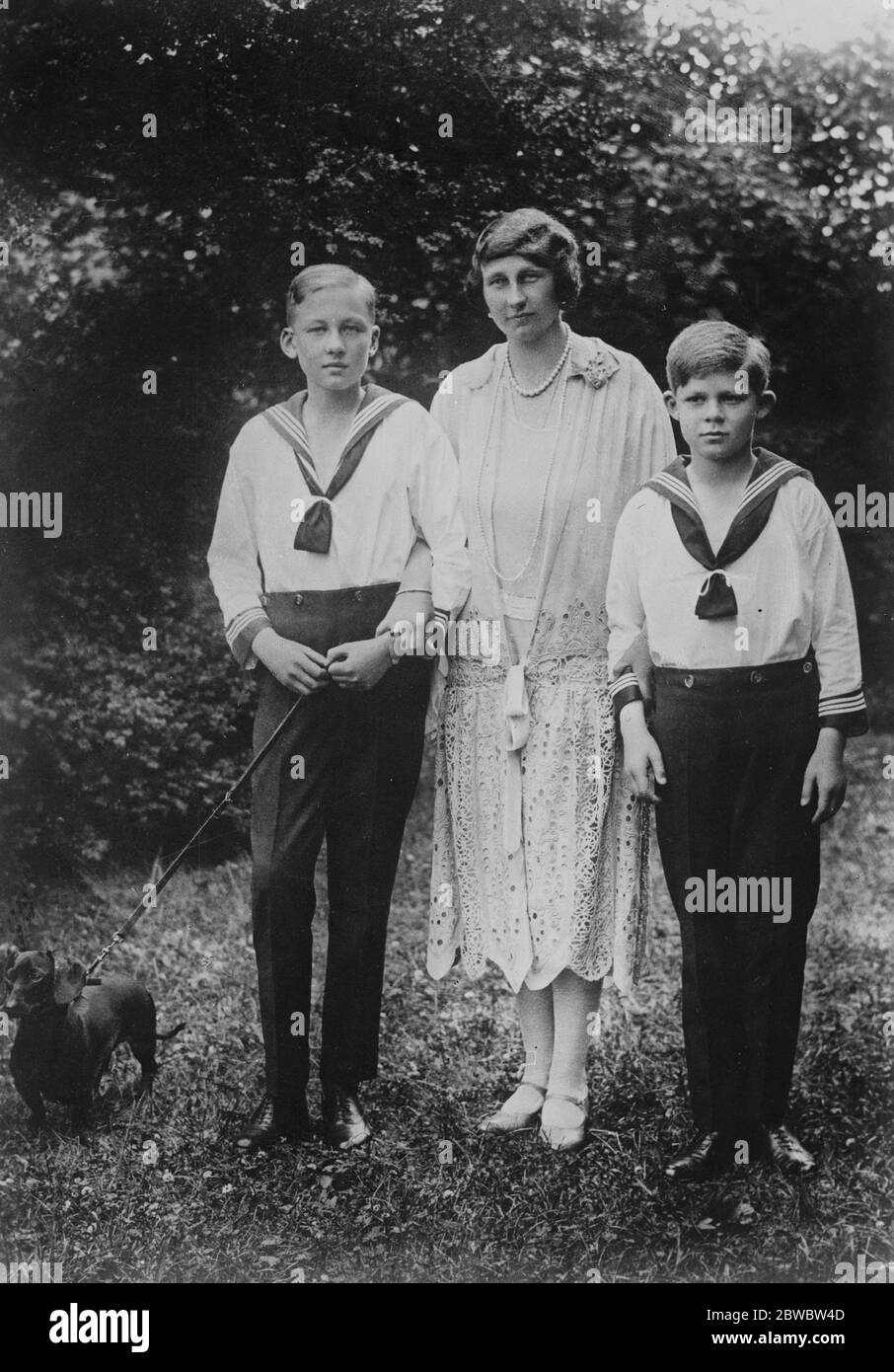 Kaiser 's grandsons growing up . The Duchess of Brunswick with her two elder sons , the Princes Ernst August and George Wilhelm ( right ) . 16 December 1926 Stock Photo