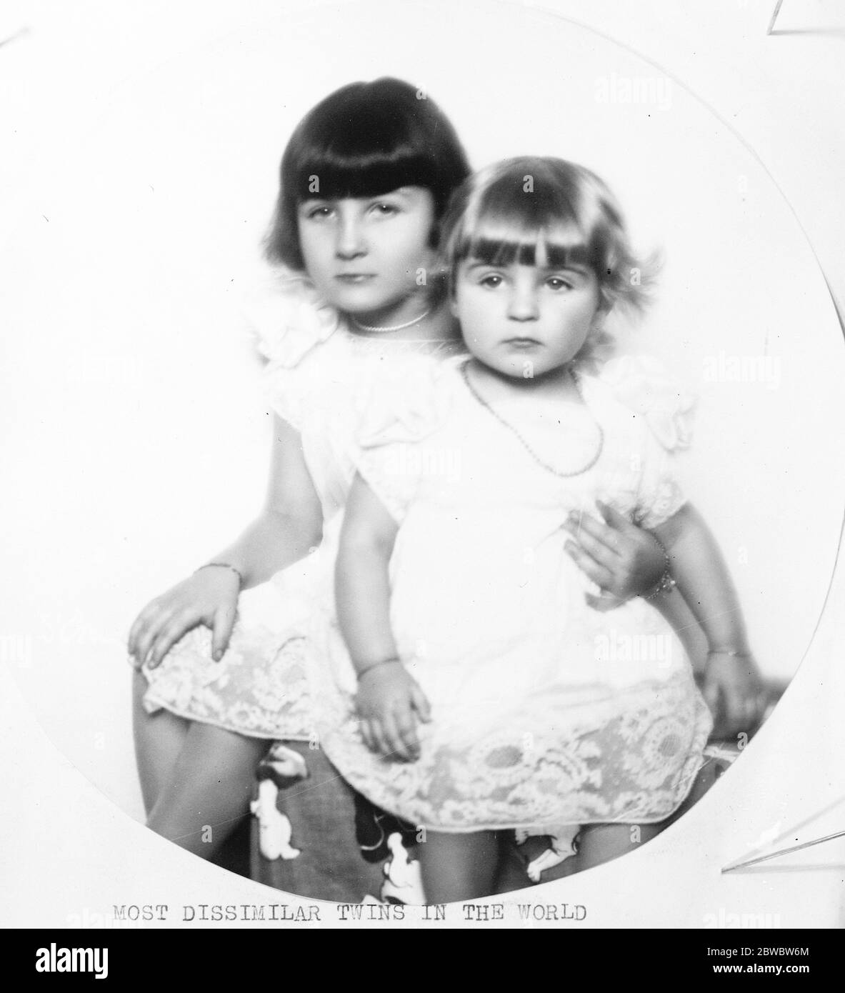 Most dissimilar twins in the world . Inez and Marie Deschamps , the small daughters of Mme Deschamps , the well known Paris society hostess . Anyone not knowing that the children were twins might well be excused for believing that there was at least 3 years difference in their ages . 2 December 1926 Stock Photo