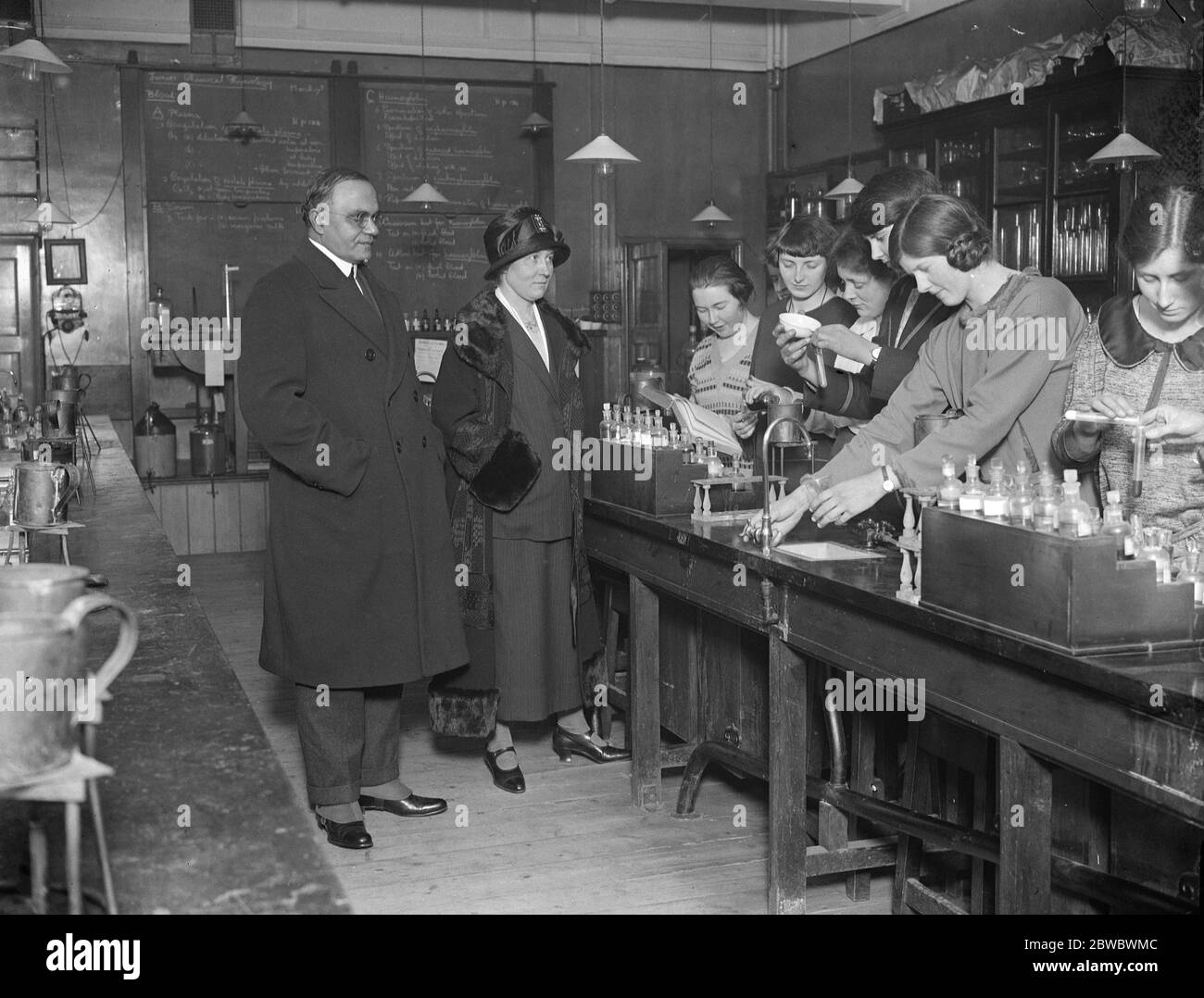 Sir Atul and Lady Chatterjee visit London School of medicine for women . Sir Atul Chatterjee and Lady Chatterjee visited the London School of Medicine for Women in recognition of the close relations between the School and India . They are seen with students in a laboratory . 17 March 1925 Stock Photo